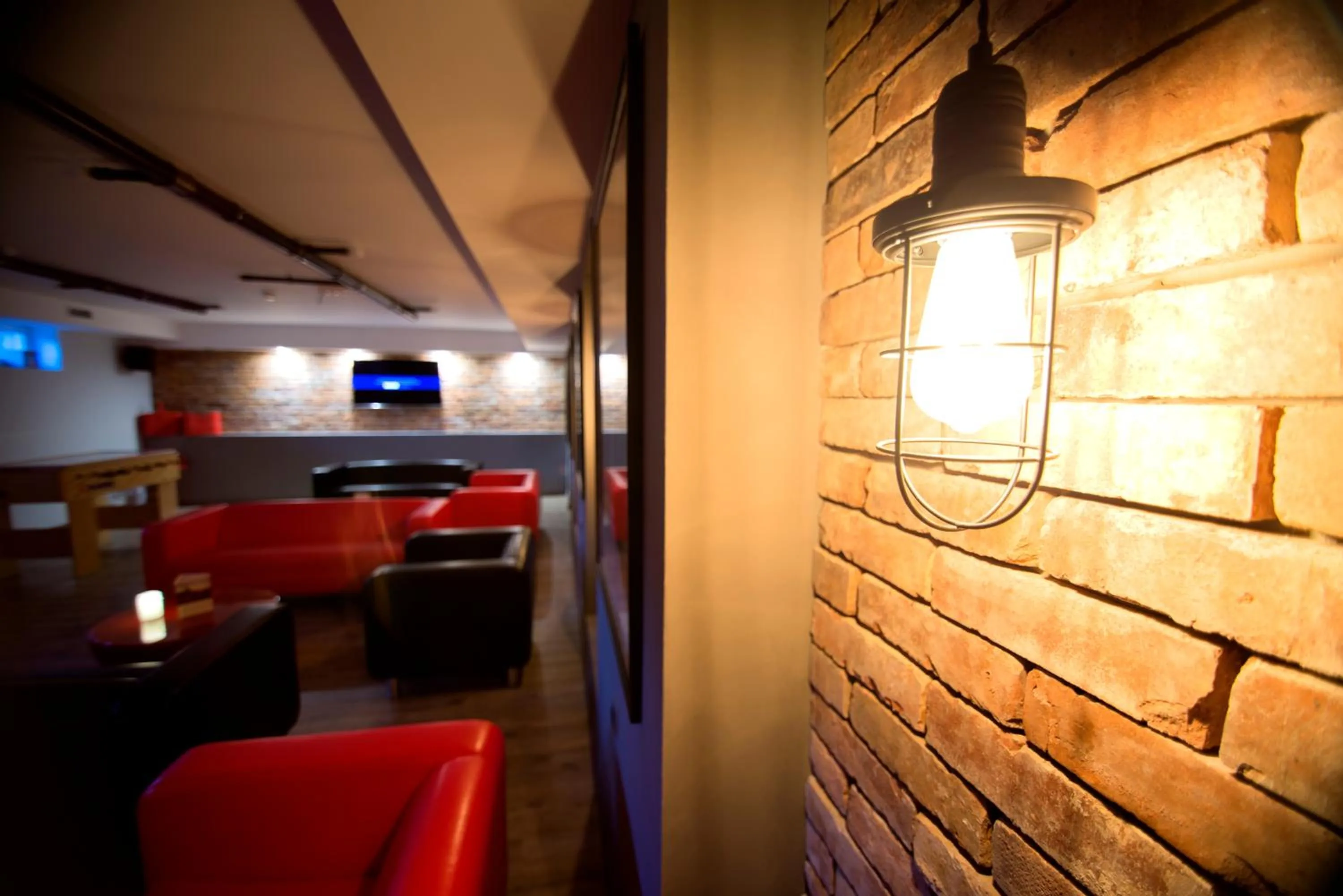 Communal lounge/ TV room in Hotel Biathlon Sport & Spa