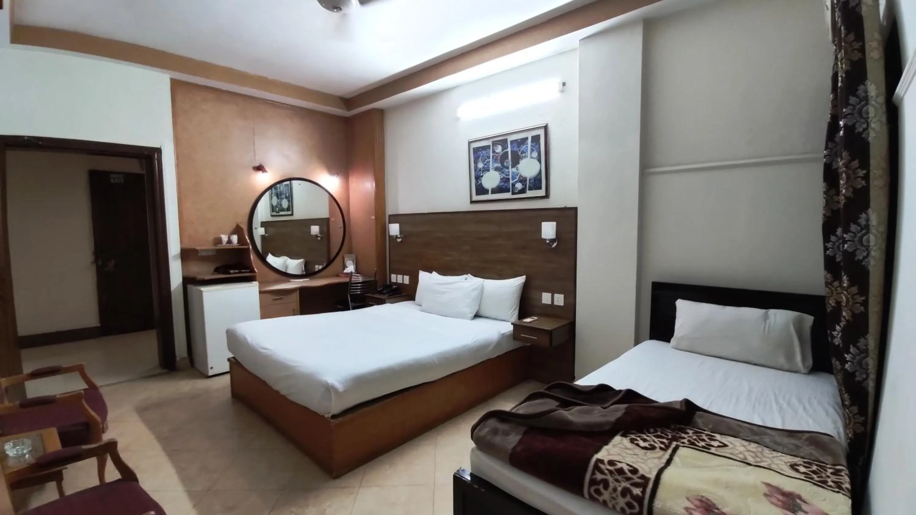 Photo of the whole room, Bed in Fiesta Inn Hotel & Resorts Multan