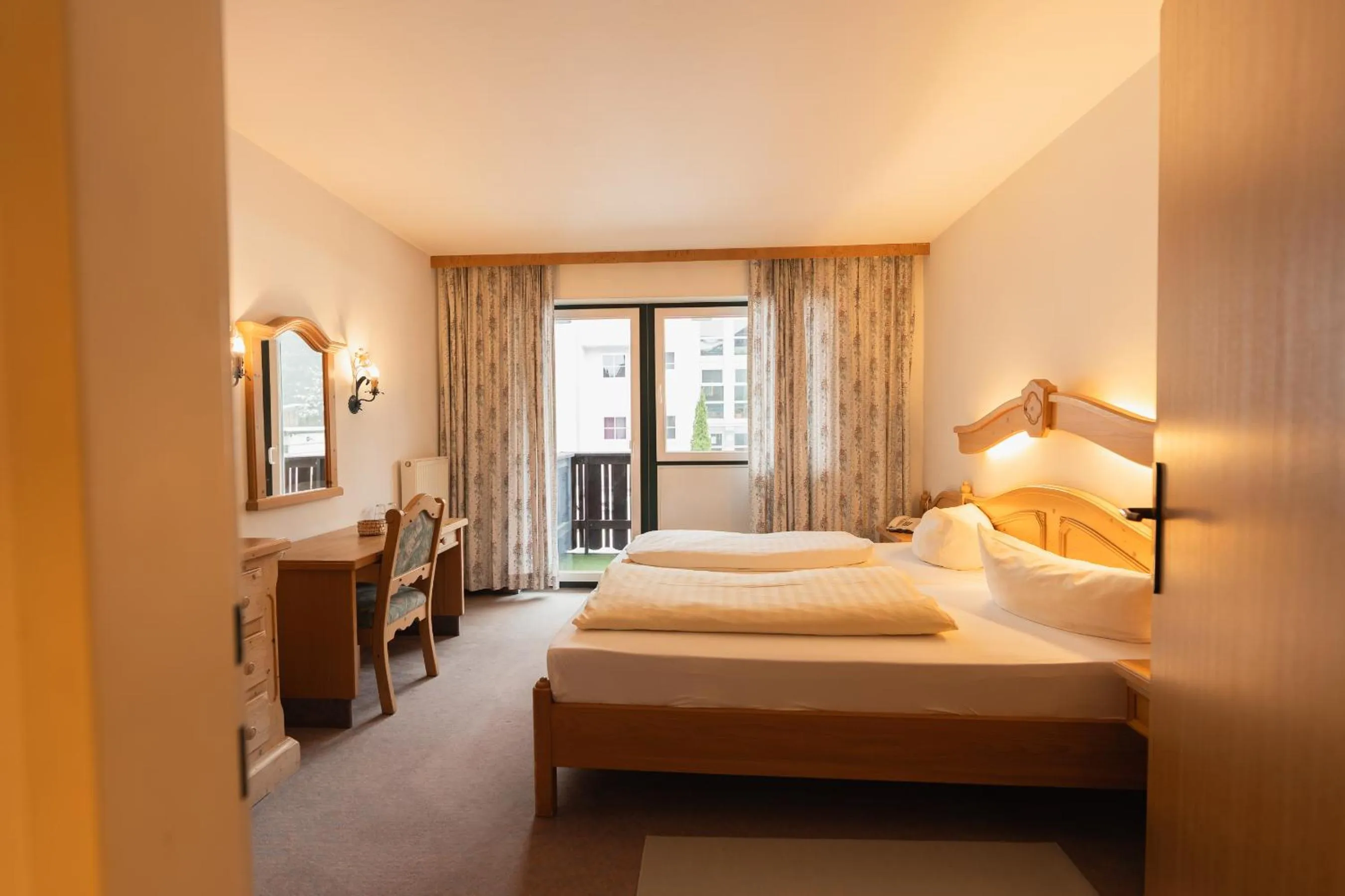 Photo of the whole room, Bed in Hotel Gruberhof Innsbruck Igls B&B