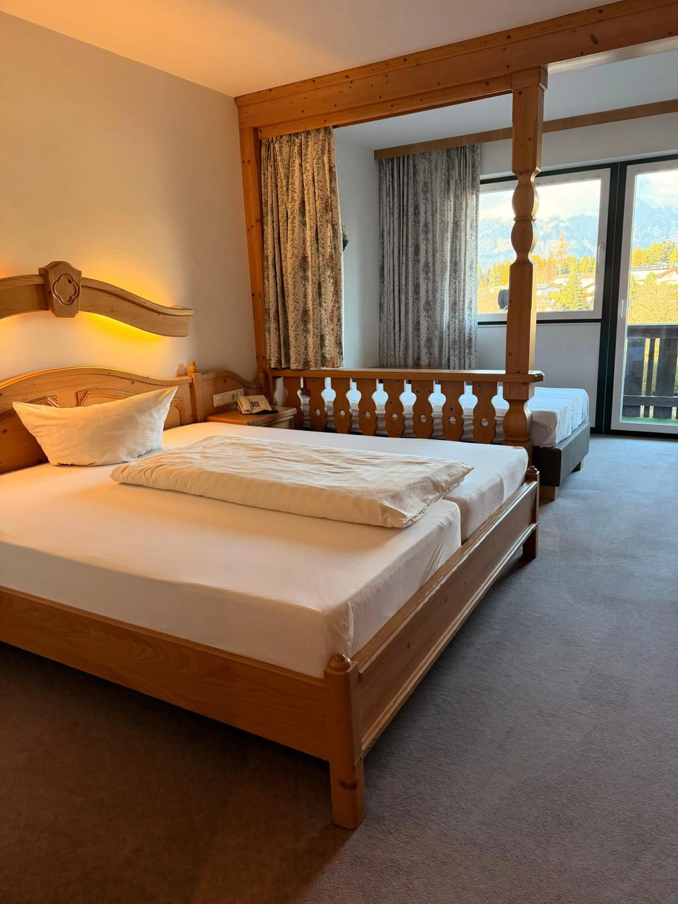 Bed in Hotel Gruberhof Innsbruck Igls B&B