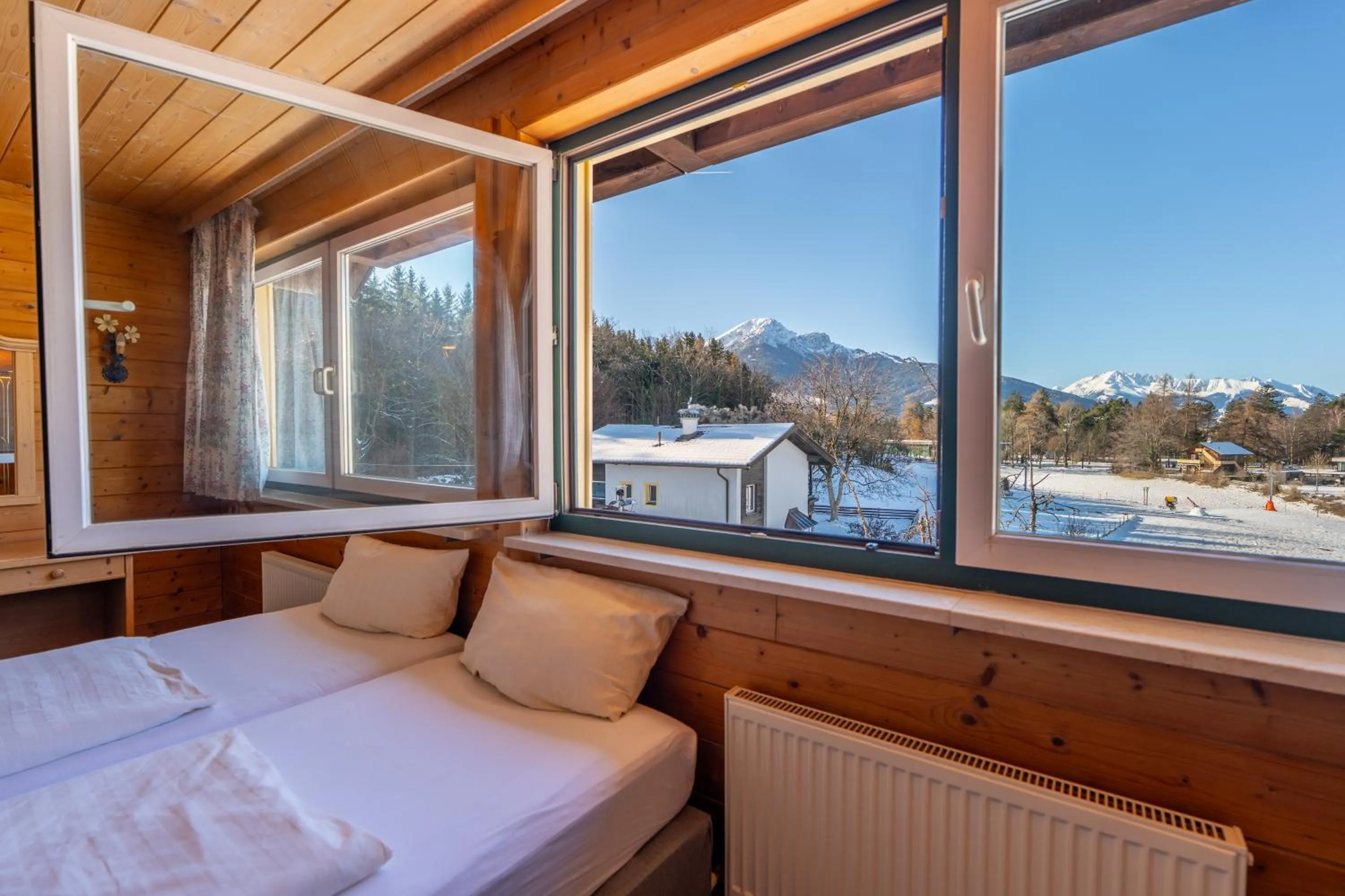 Bed in Hotel Gruberhof Innsbruck Igls B&B