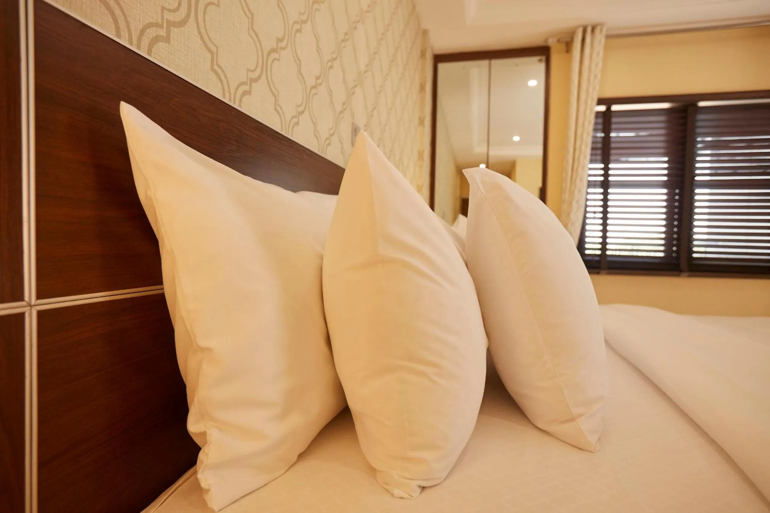 Bed in Belanova Apartments and Suites