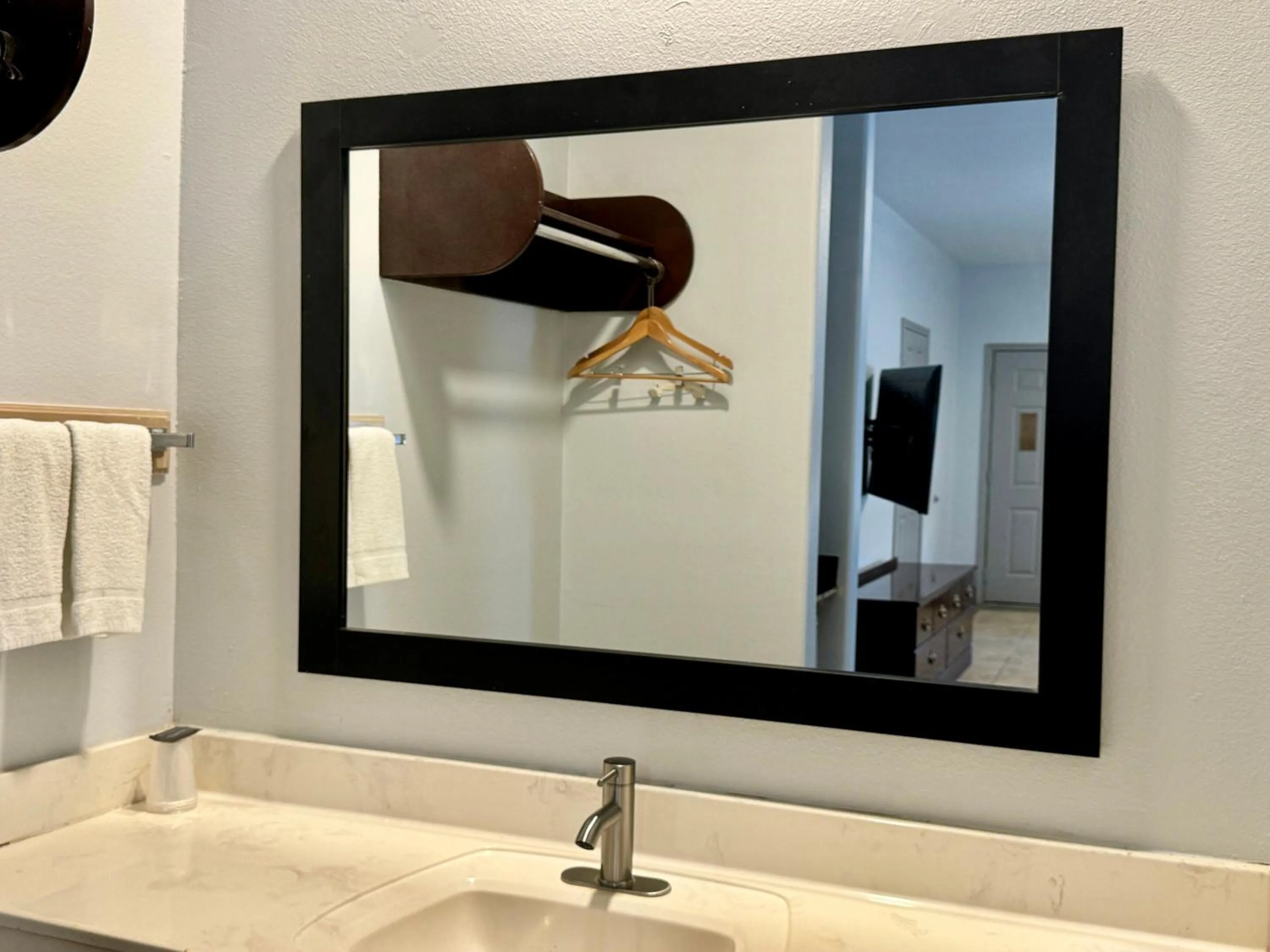 Bathroom in Texas Inn and Suites City Center at University Dr.