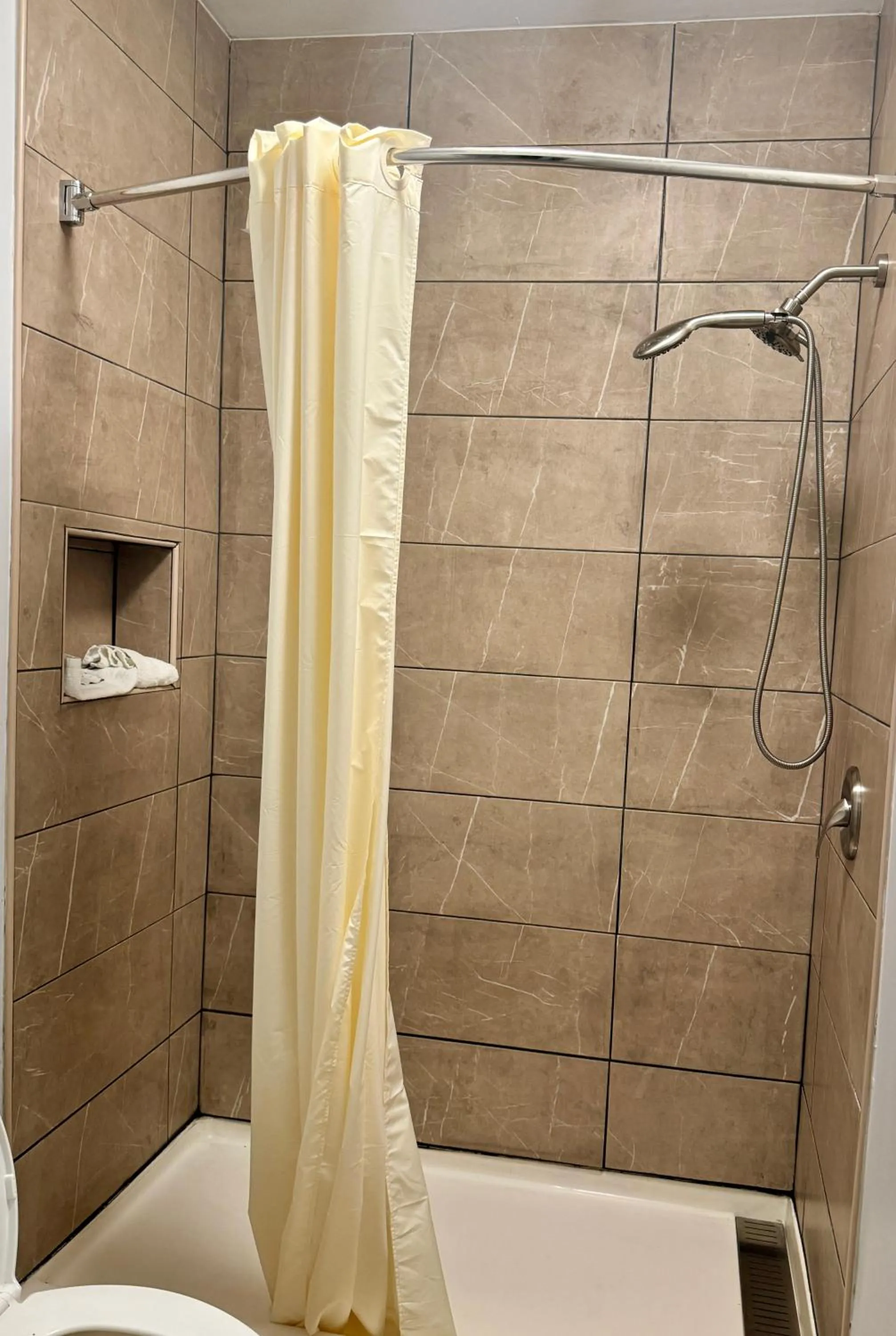 Shower in Texas Inn and Suites City Center at University Dr.