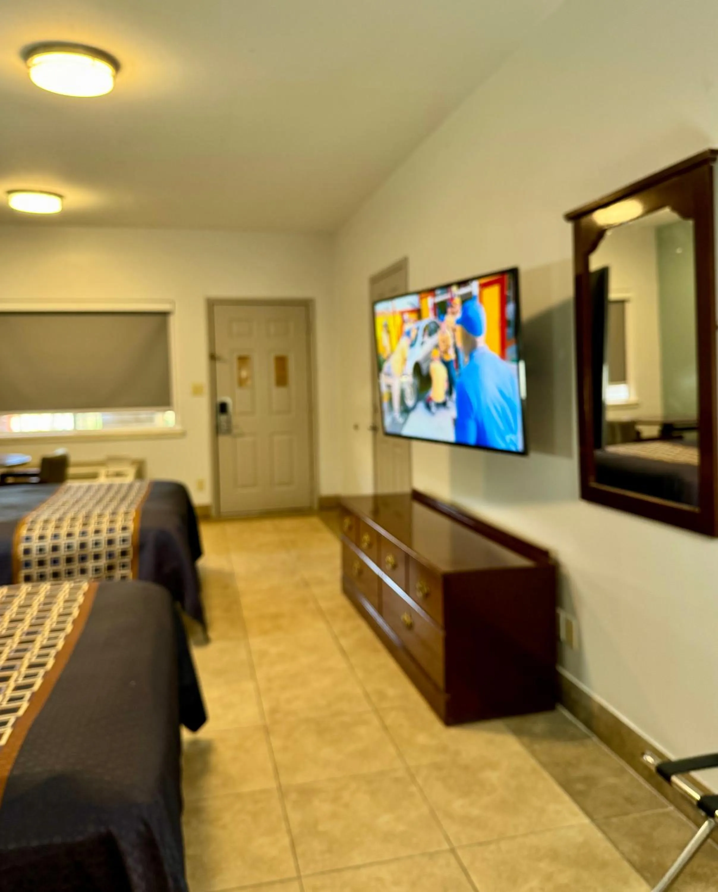 Bed in Texas Inn and Suites City Center at University Dr.