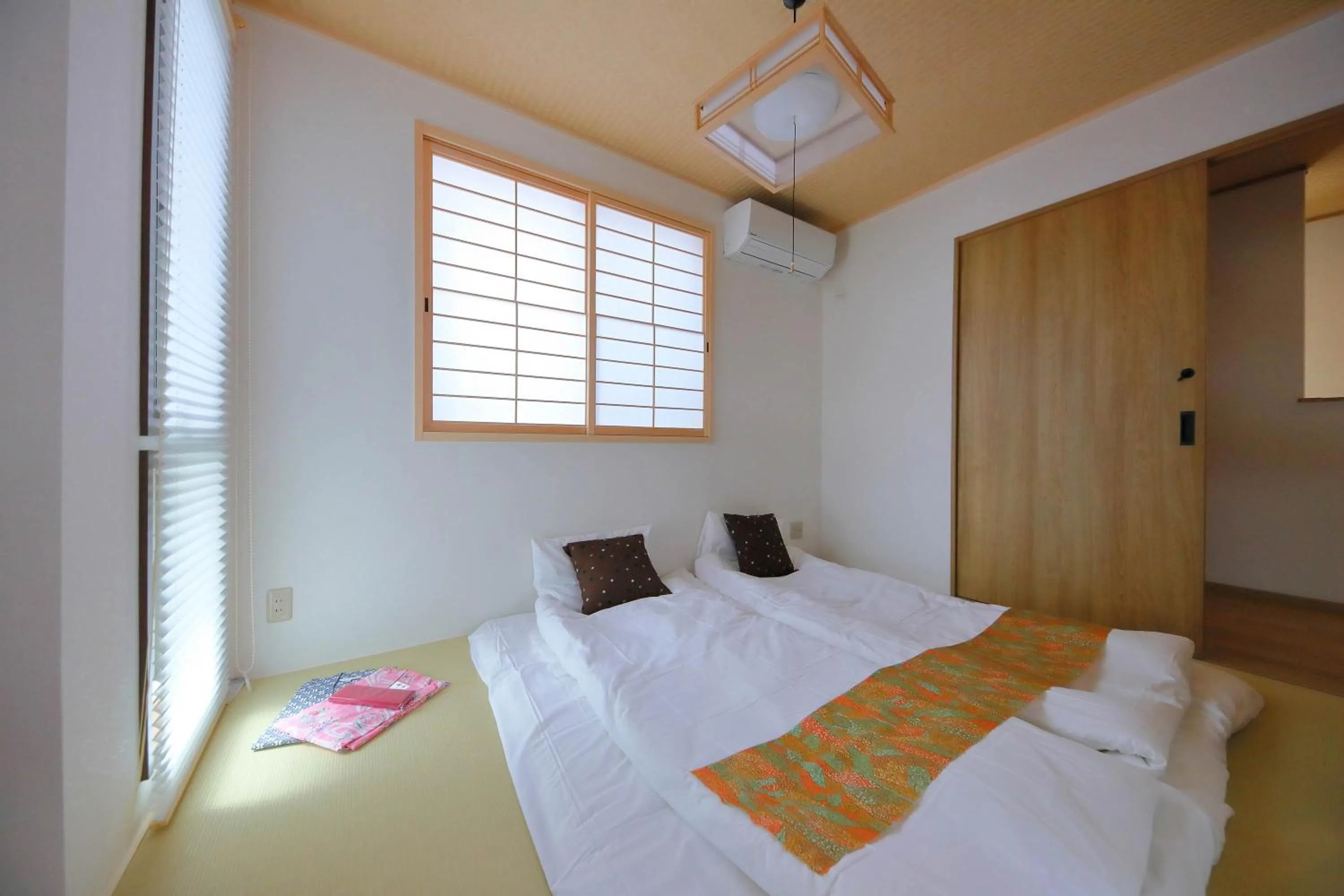 Bed in Kyo Machiya Ryokan Yuan