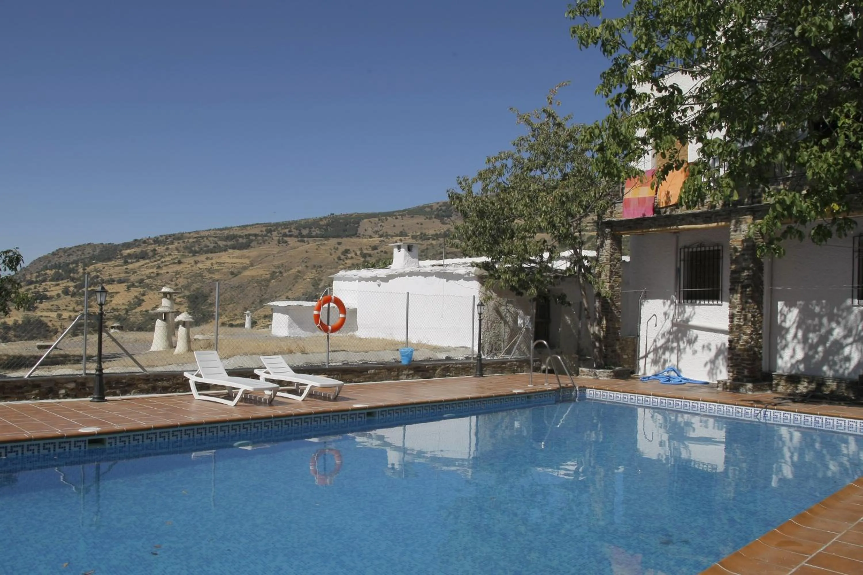 Swimming pool in Hotel Rural Poqueira II