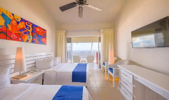 Bed in Grand Decameron Complex Bucerias, A Trademark All-Inclusive Resort