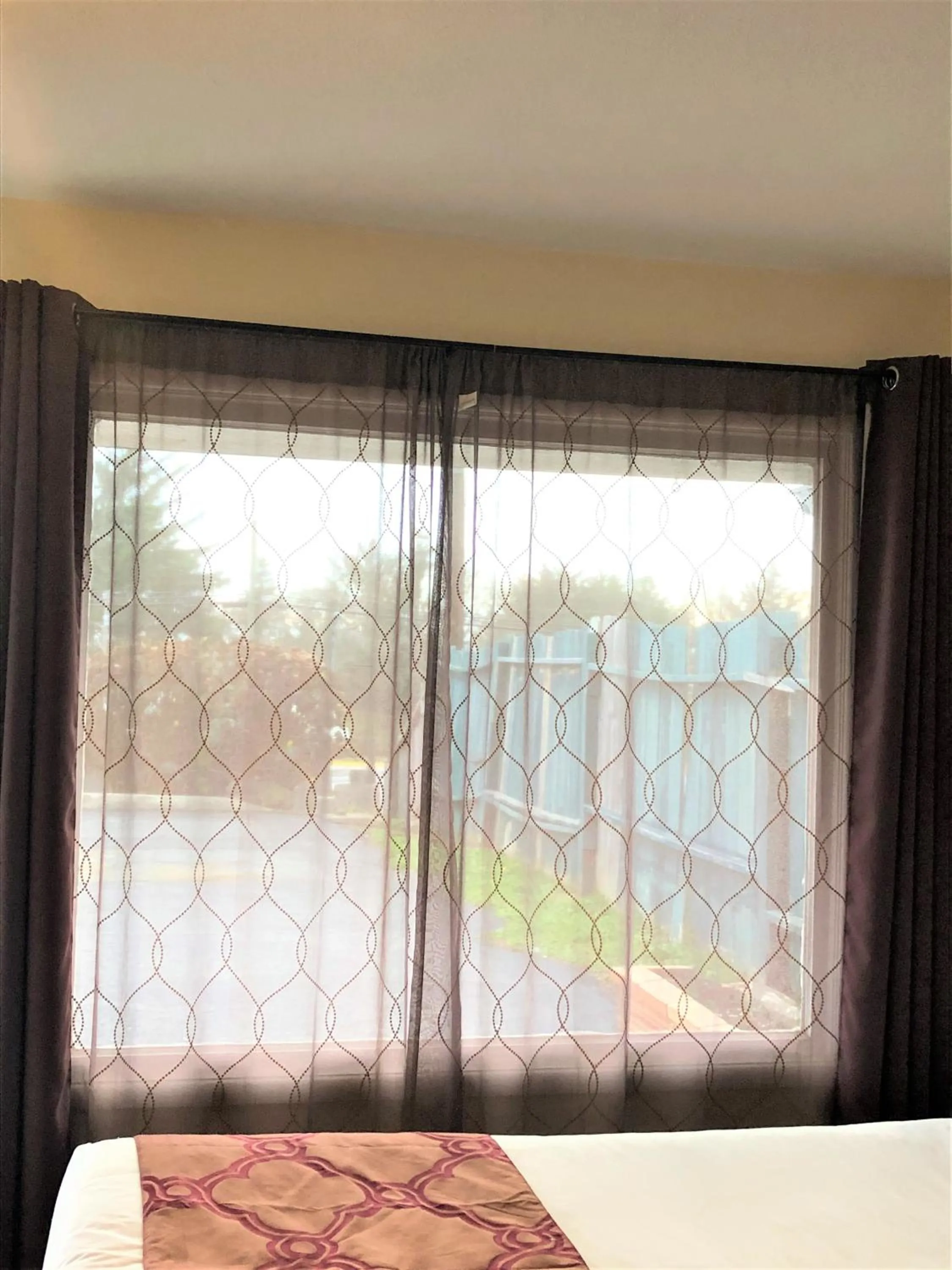 View (from property/room), Bed in Blue Coast Inn & Suites