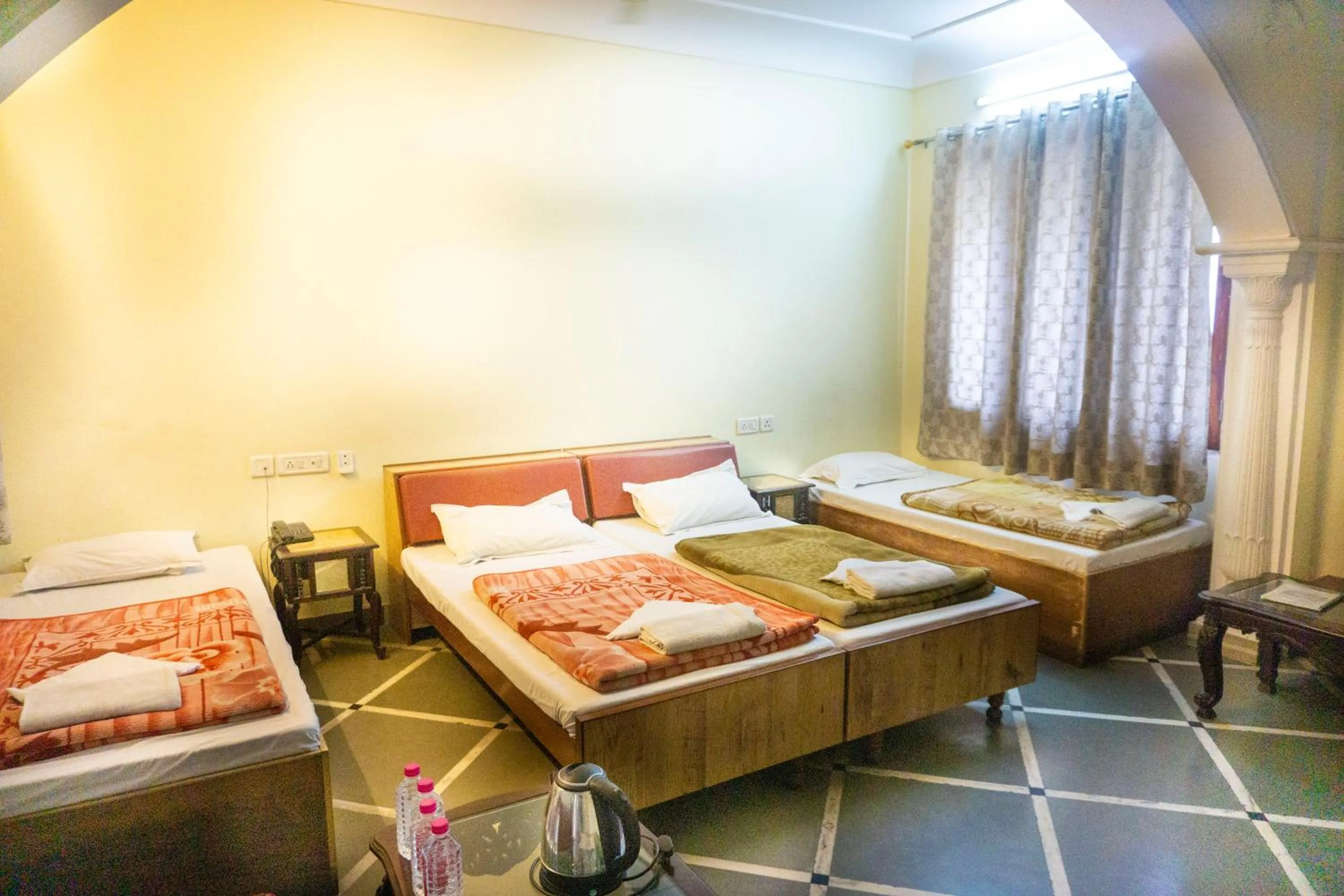 Bed in Krishna Palace - A Heritage Boutique Hotel