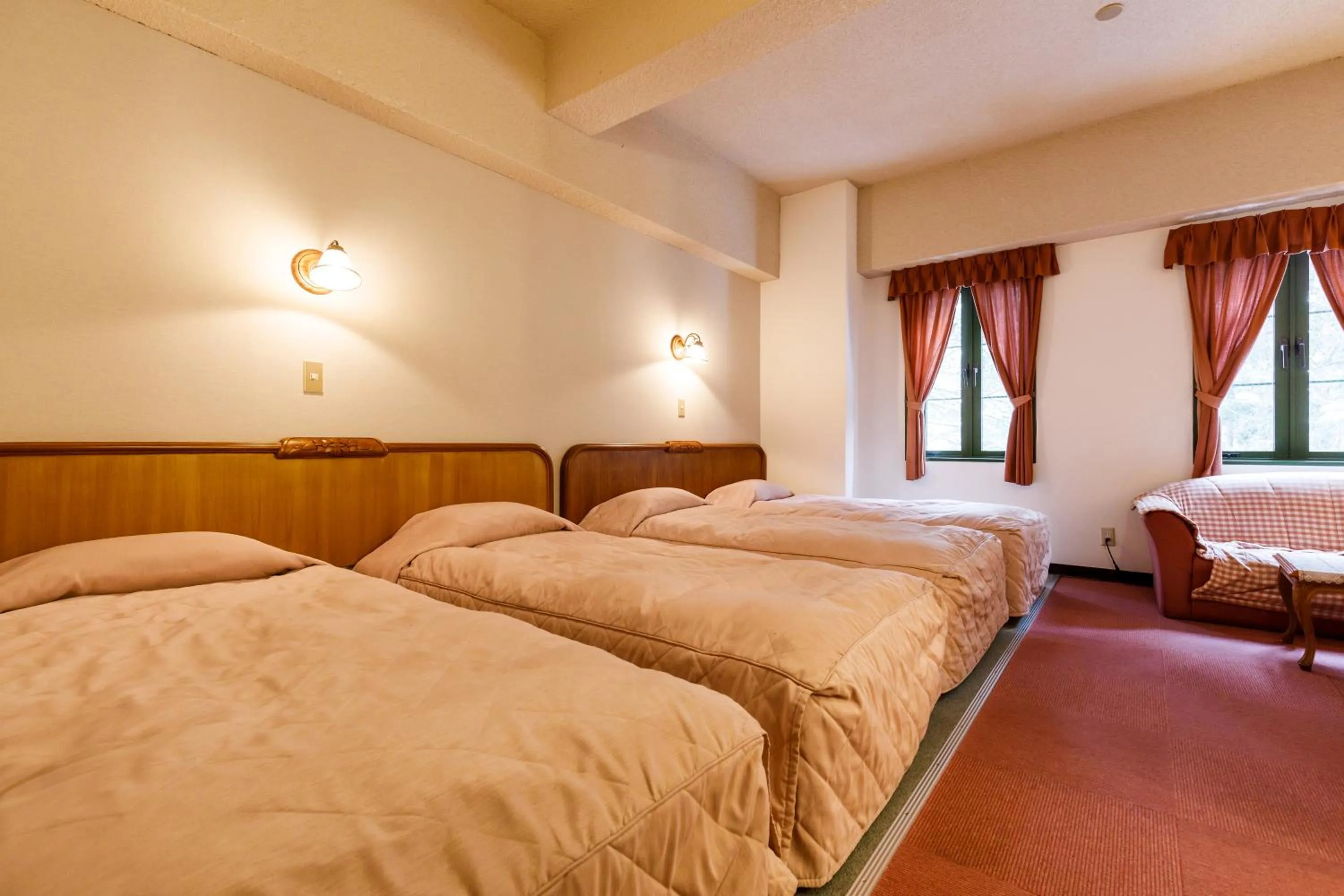 Bed in ホテルけやきの樹