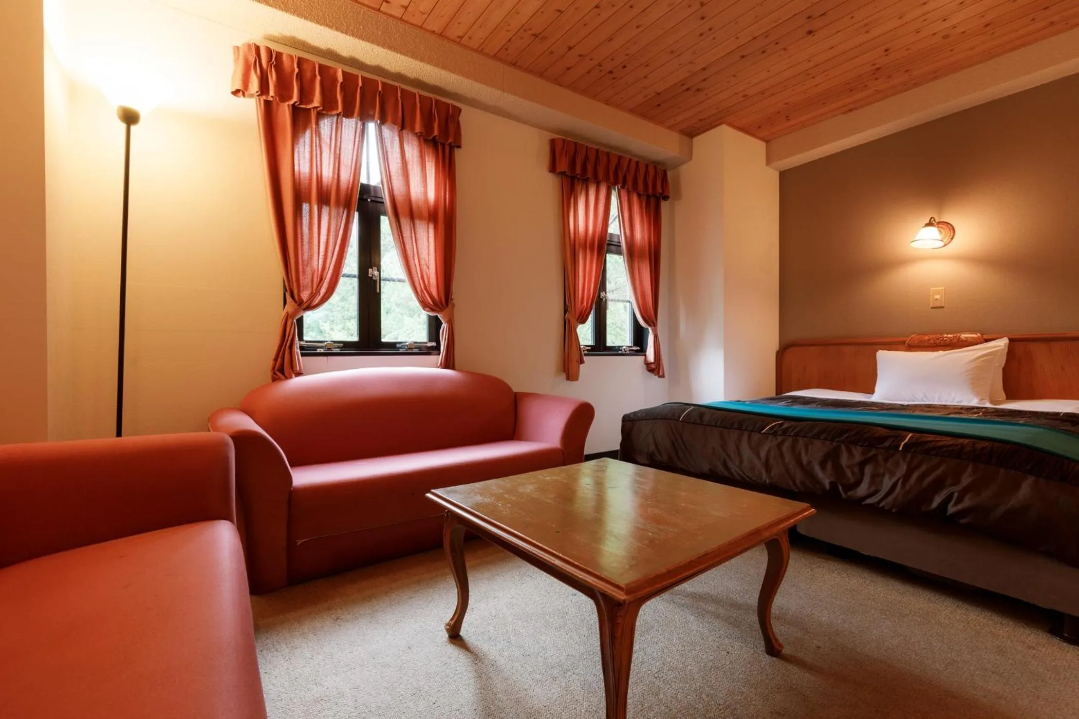 Bed in ホテルけやきの樹