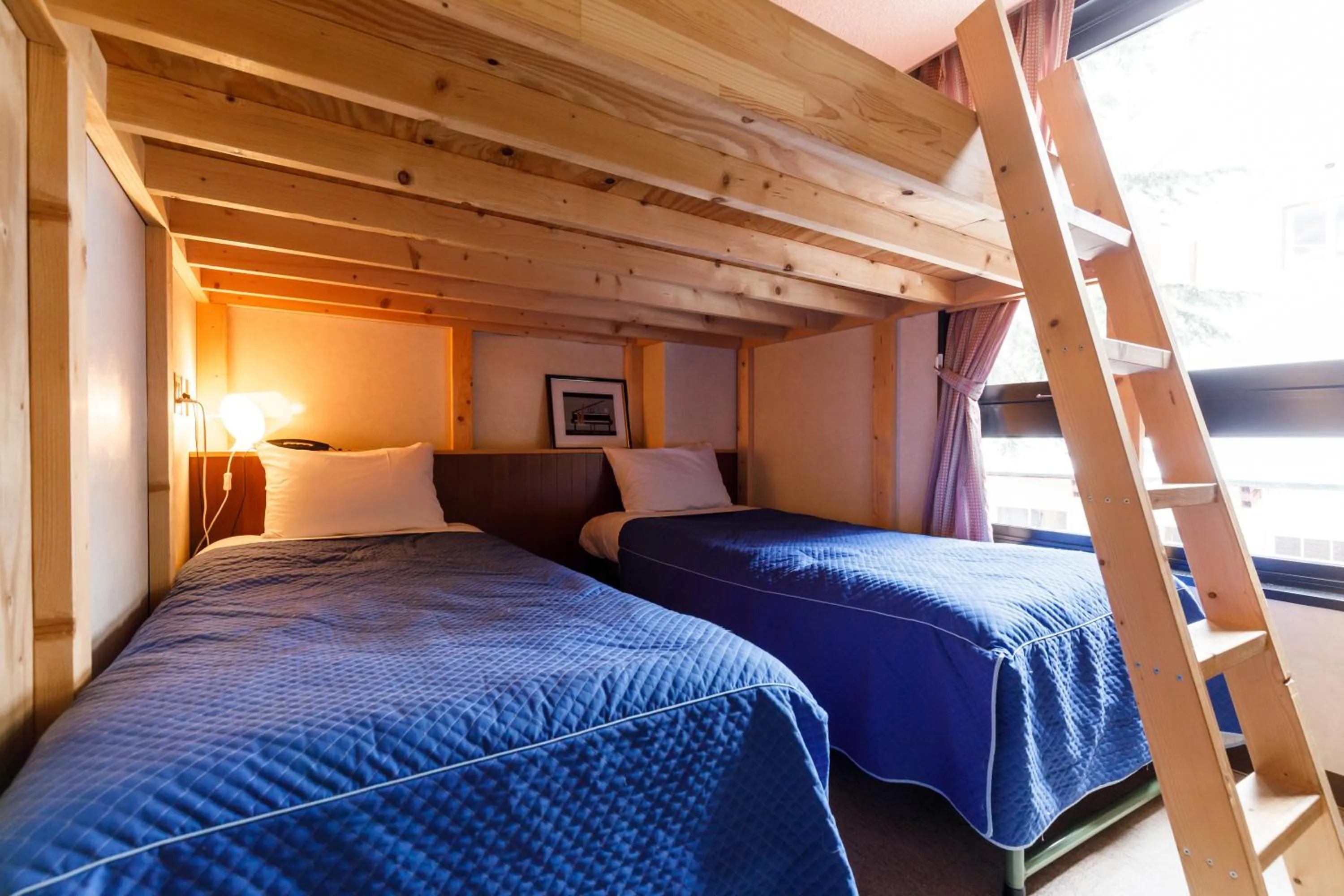 Bed in ホテルにれの樹