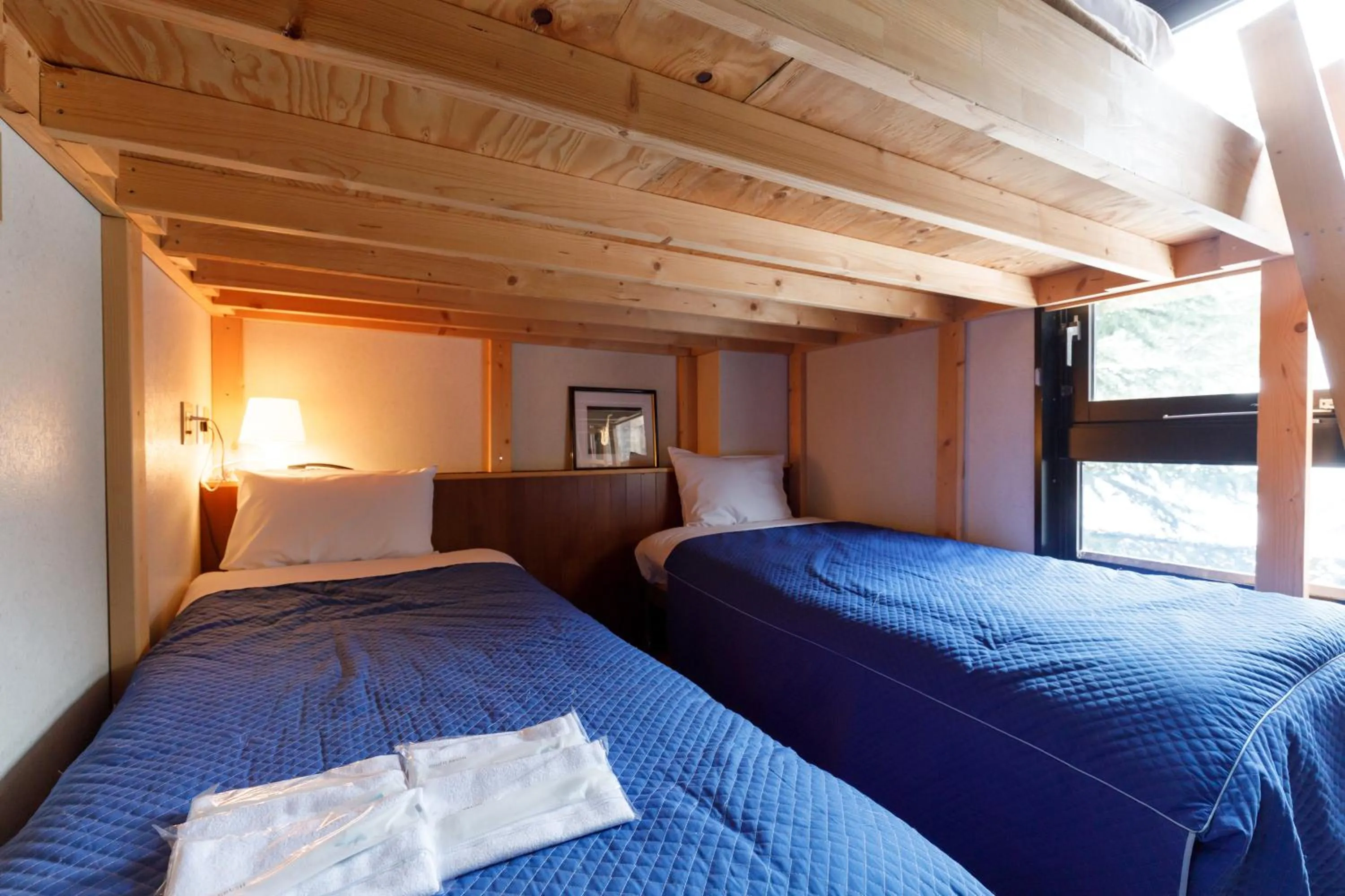 Bed in ホテルにれの樹