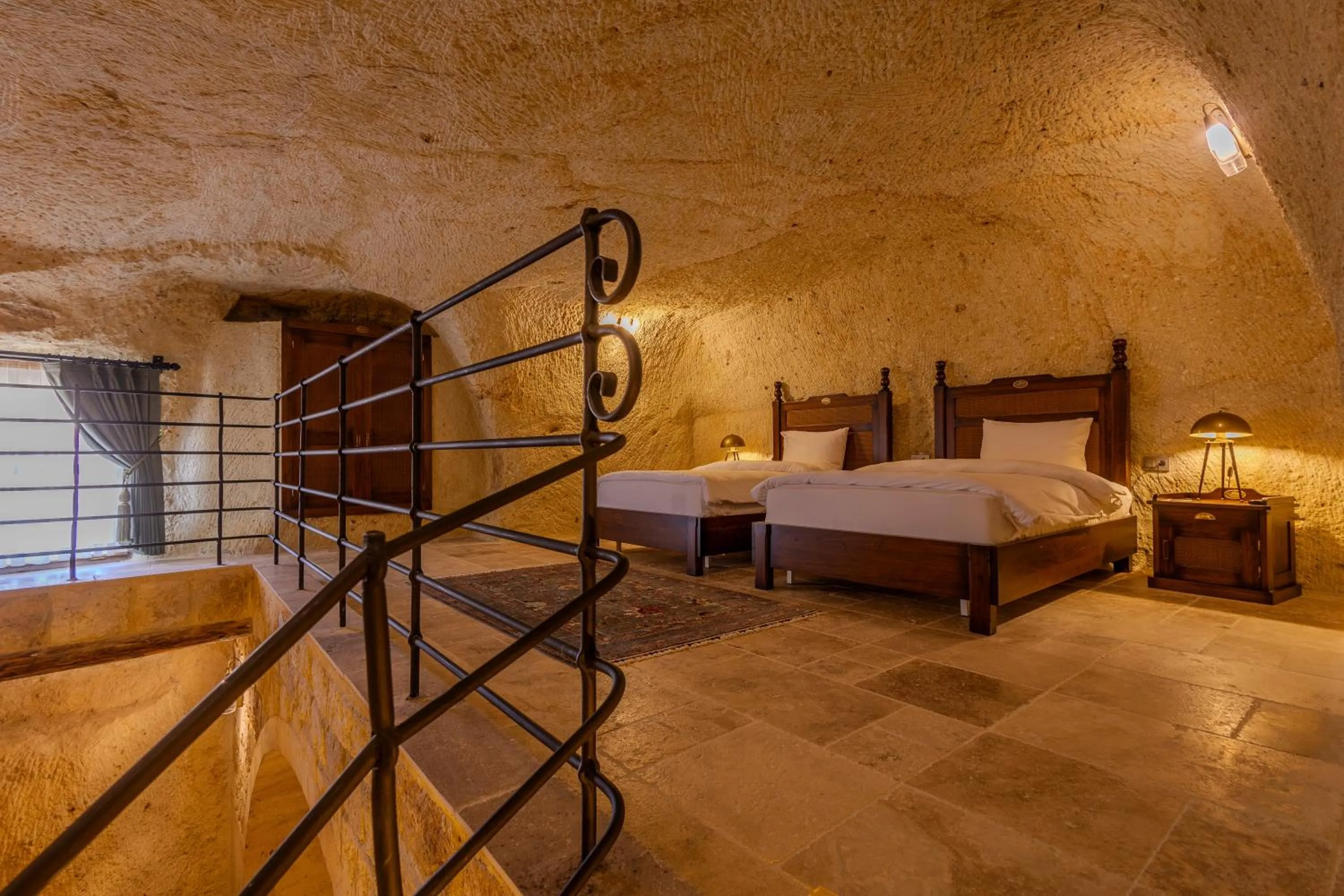 Bed in Seraphim Cave Suites & SPA