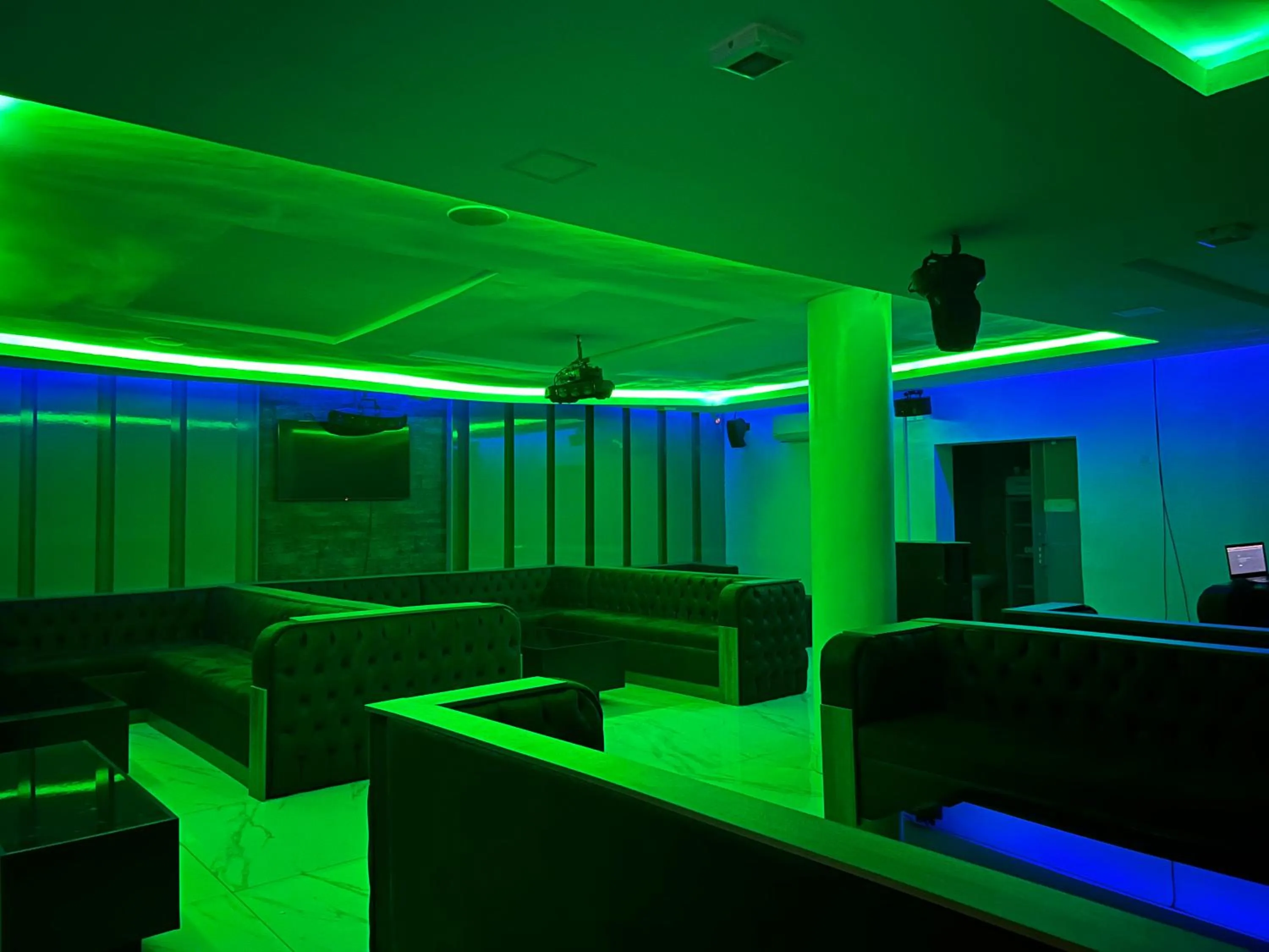 Communal lounge/ TV room in Rollace Hotel