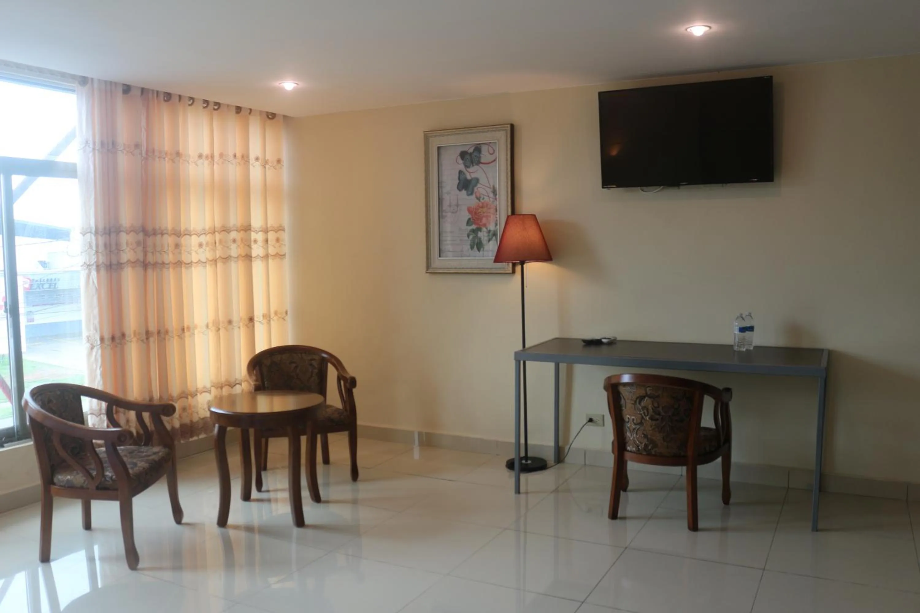 Communal lounge/ TV room in Hotel F Sur Inn