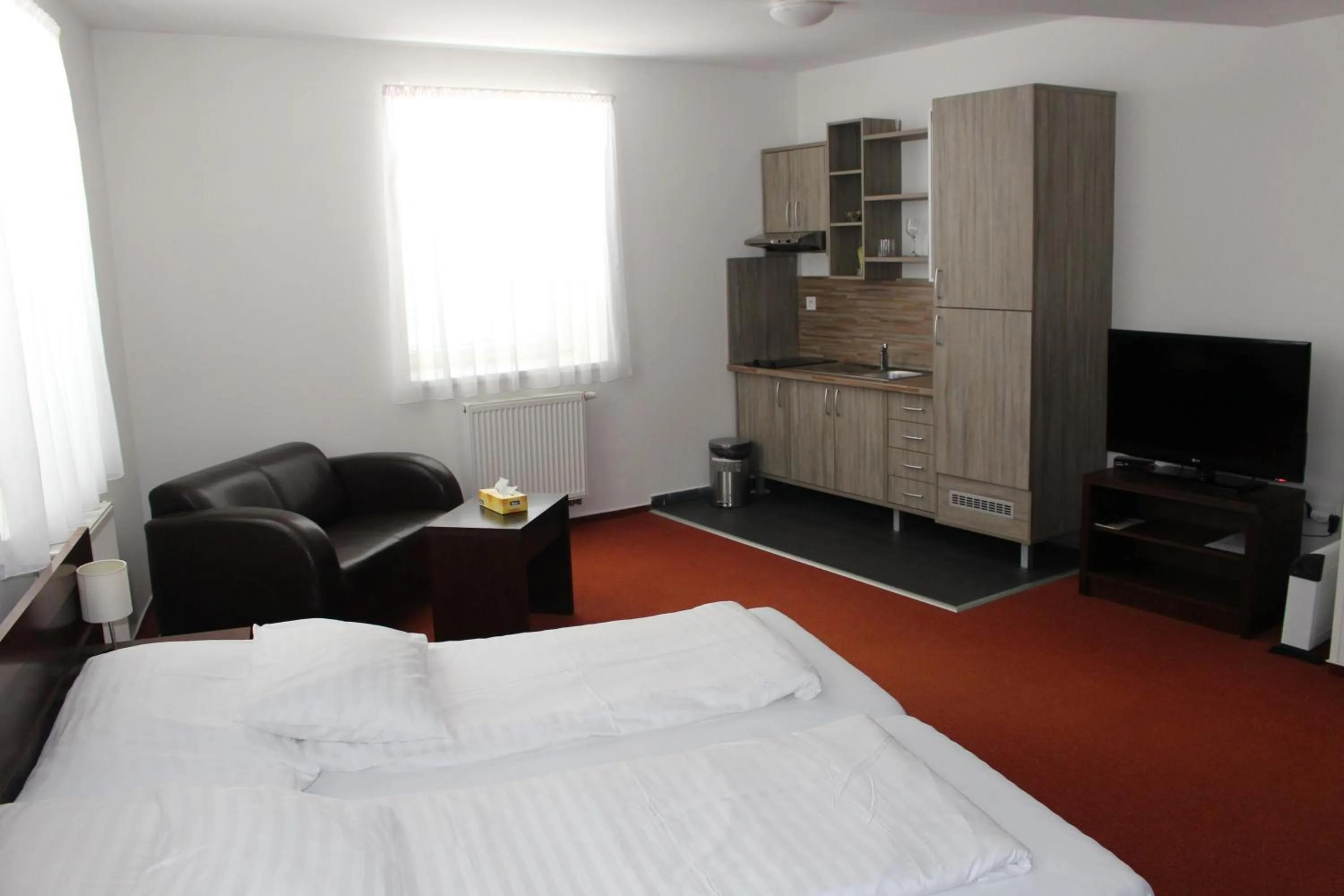 Kitchen or kitchenette, Bed in Hotel Palác