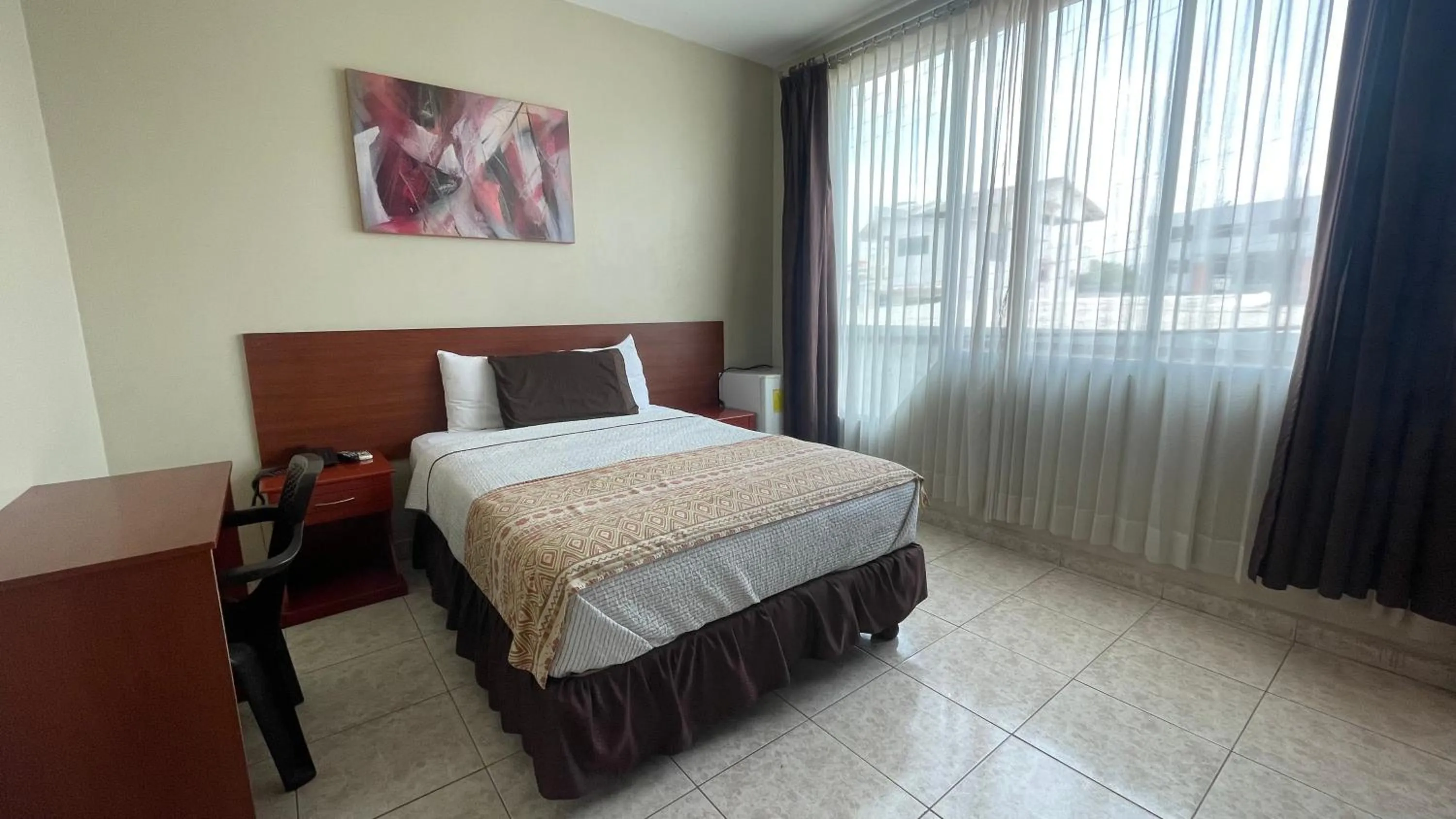 Bed in Hotel Air Suites