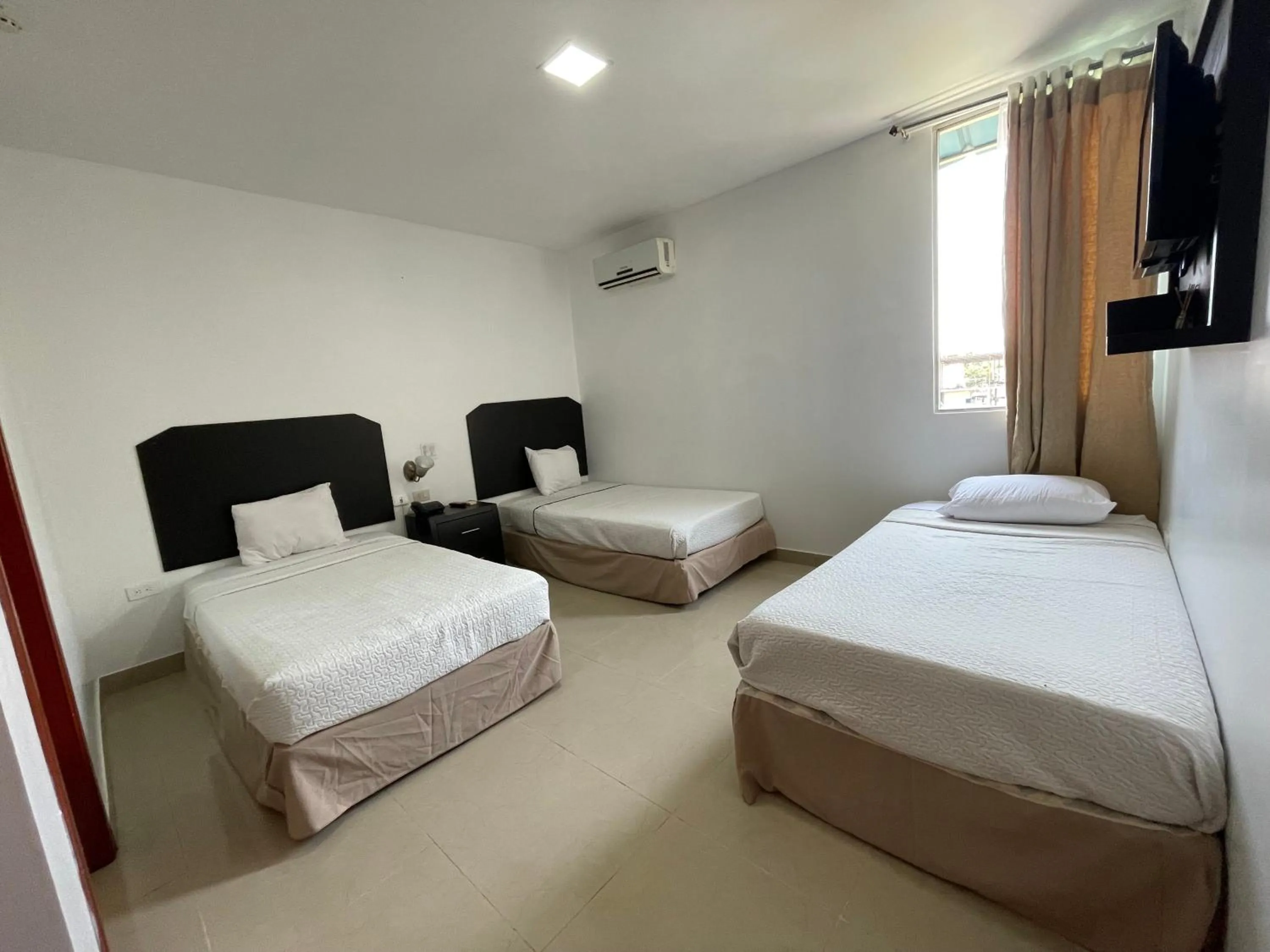 Bed in Hotel Air Suites