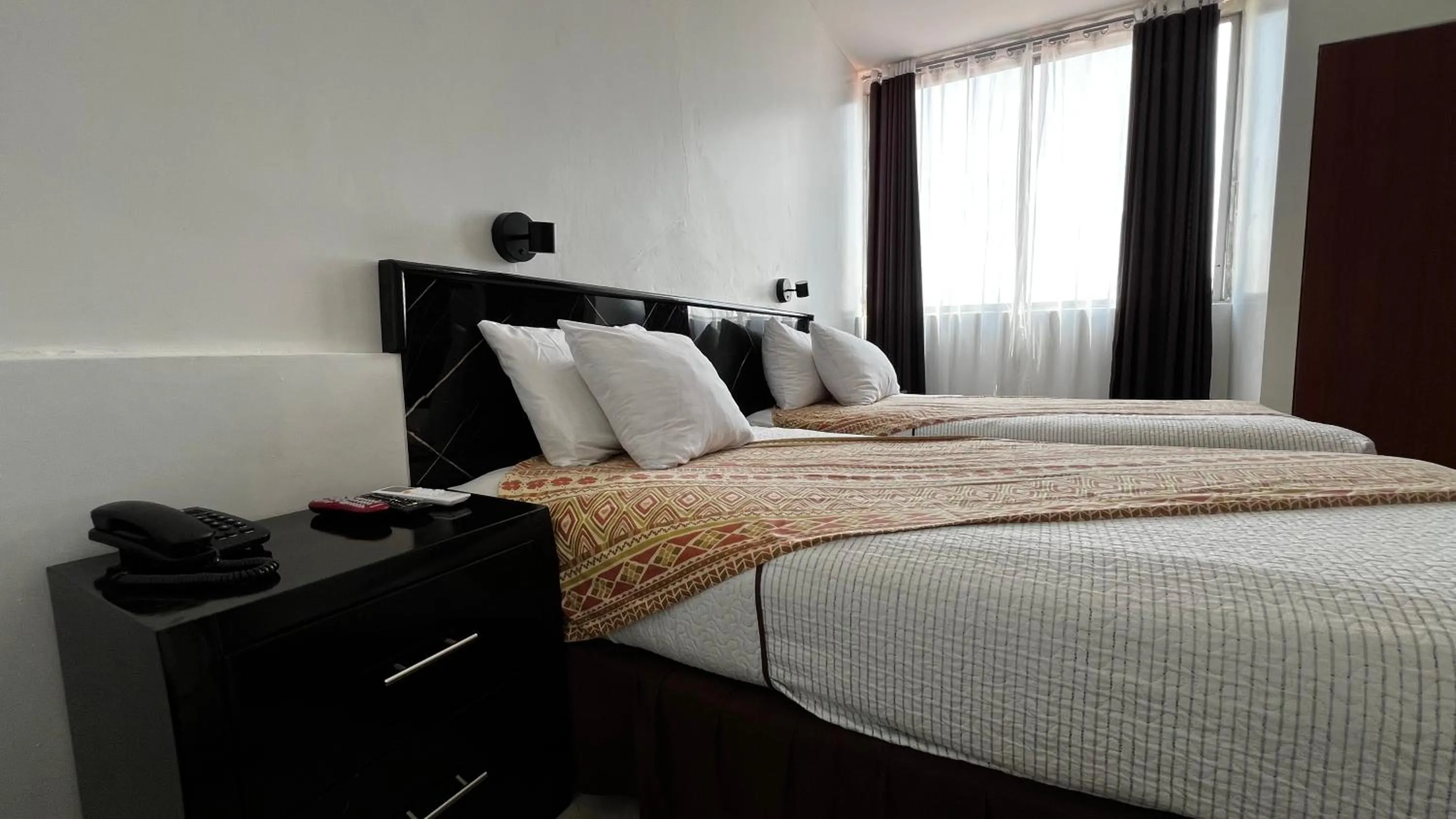 Bed in Hotel Air Suites