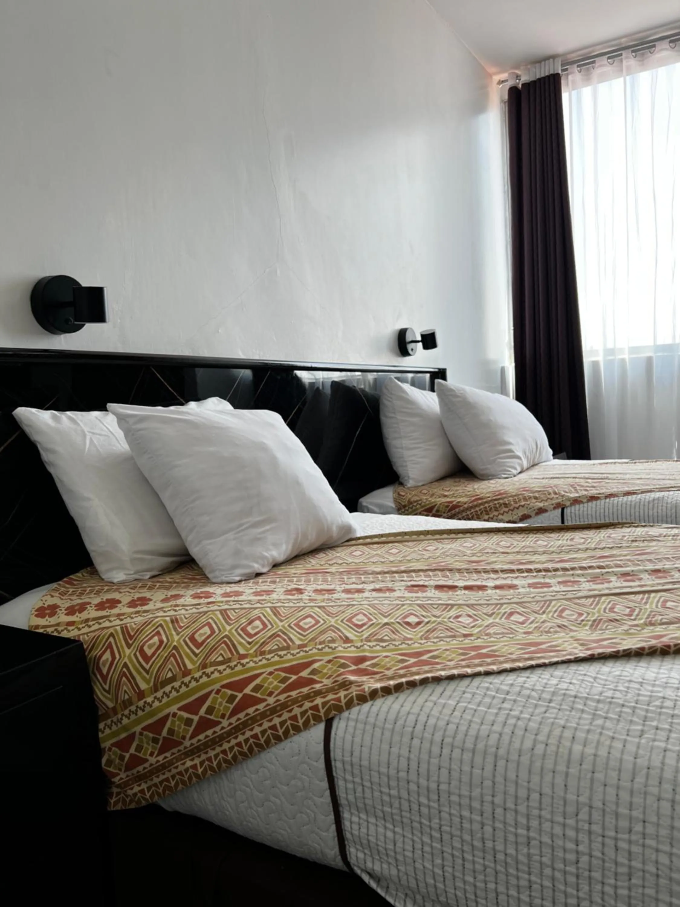 Bed in Hotel Air Suites