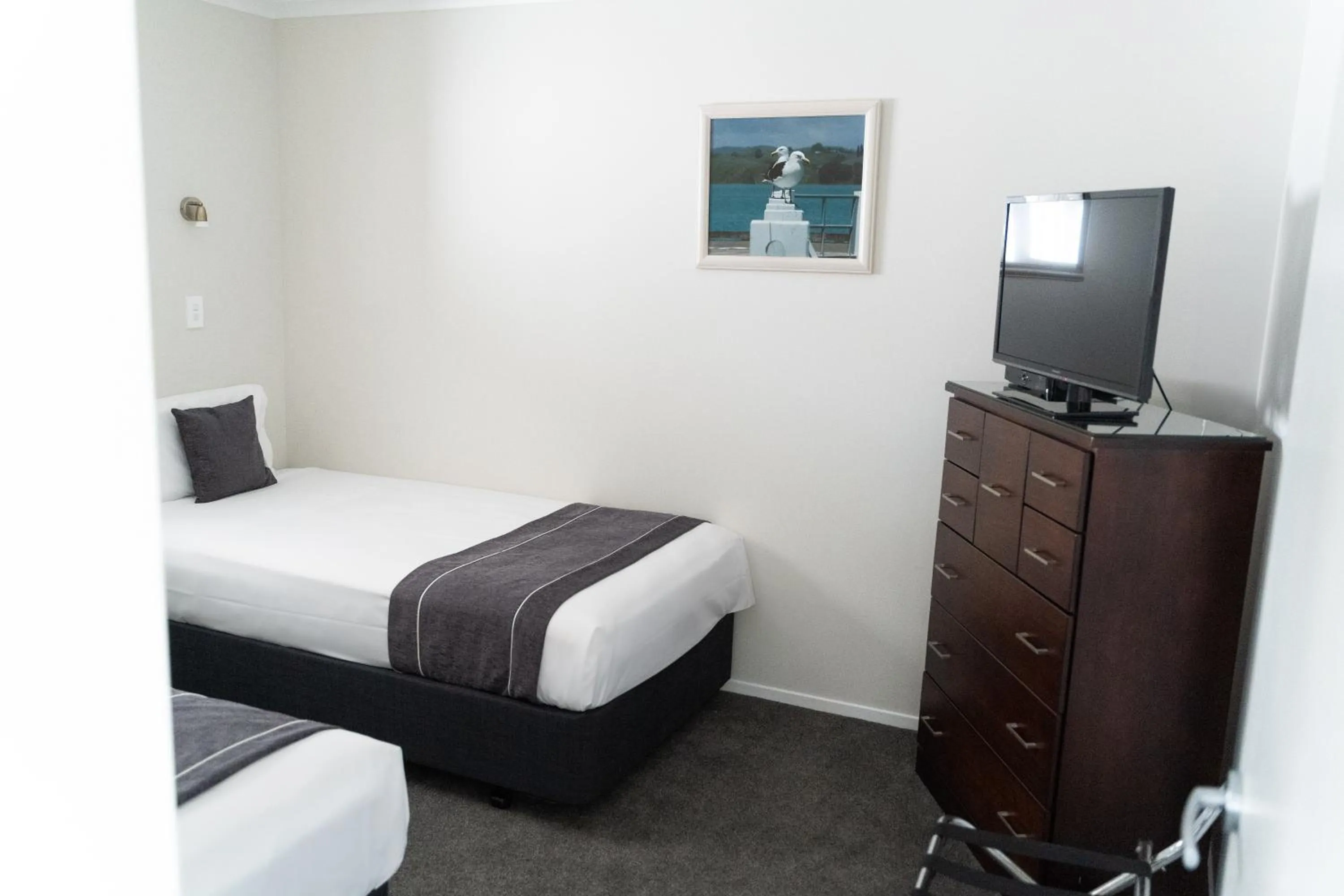 Bed in Pacific Coast Motor Lodge