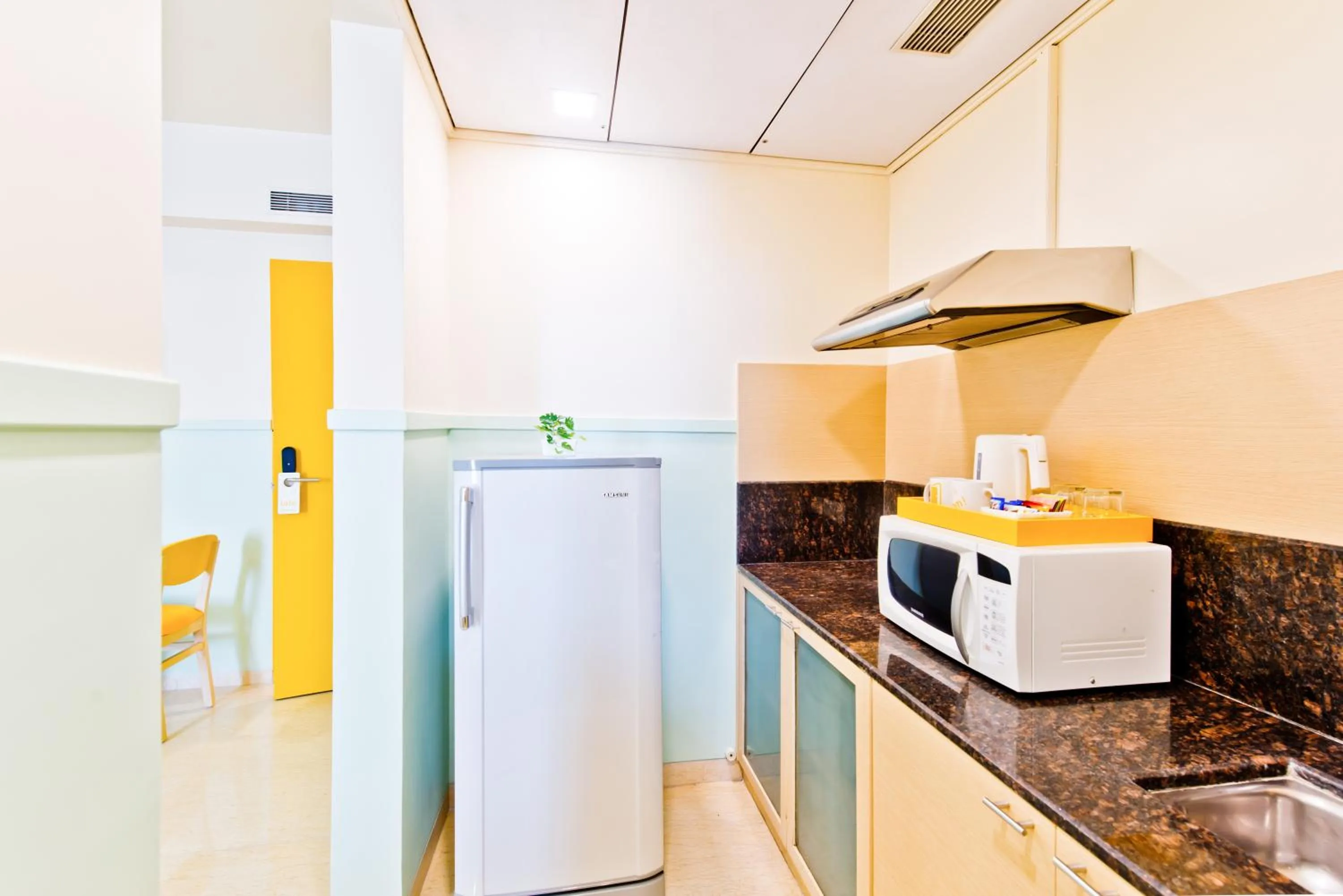 Kitchen or kitchenette in Bloom Hotel - Indiranagar