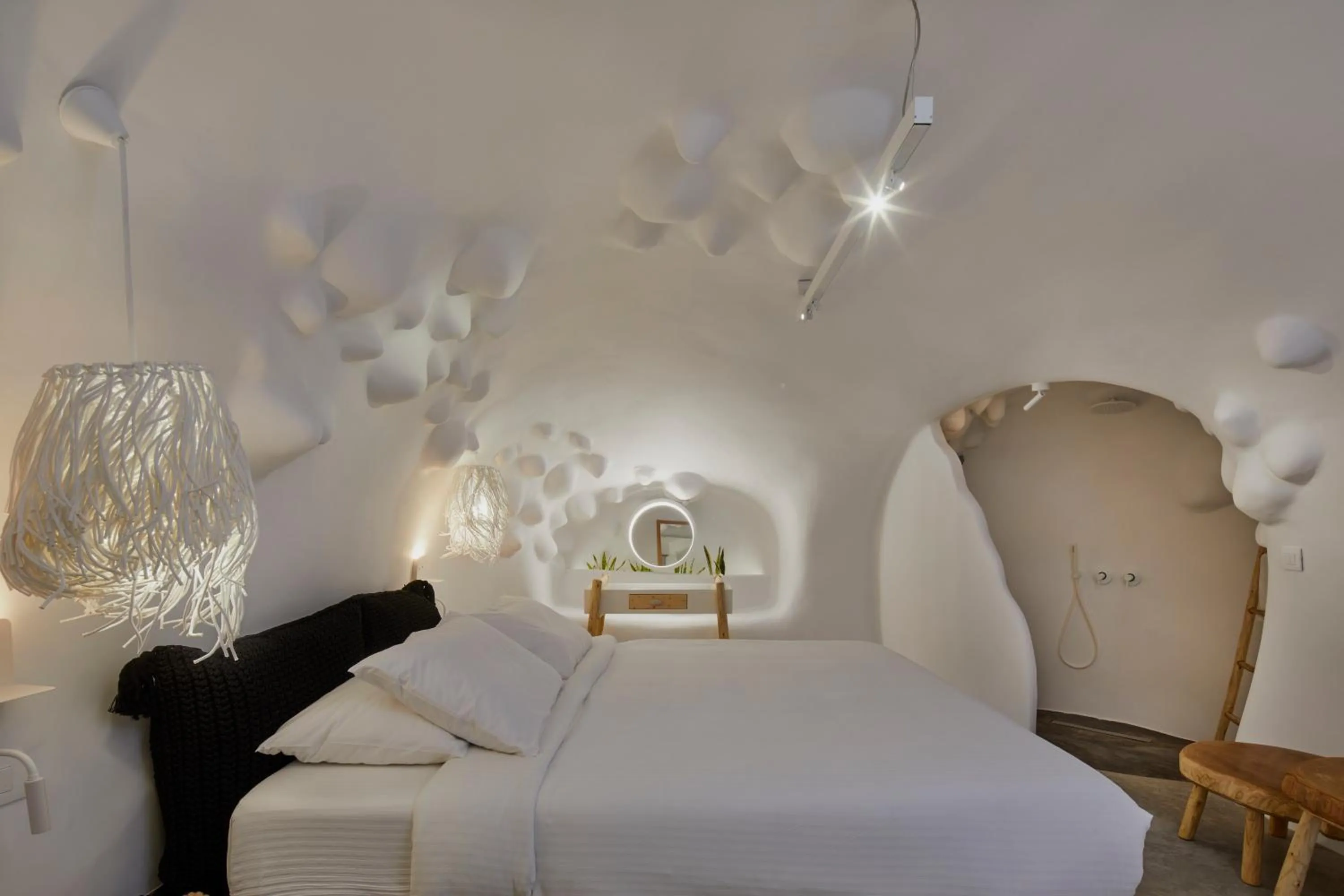 Bed in Theano Cave Suites & Villas