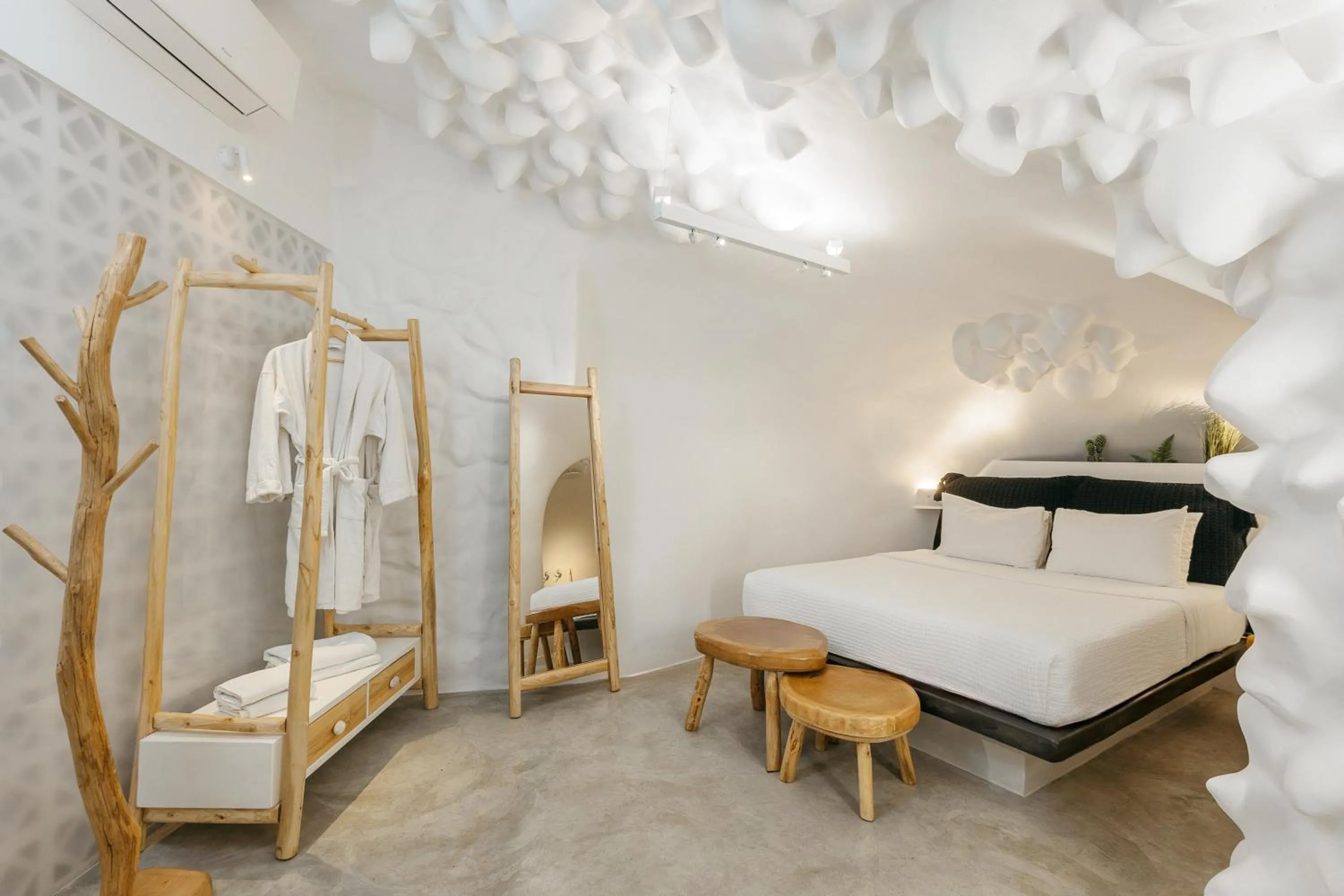 Bed in Theano Cave Suites & Villas