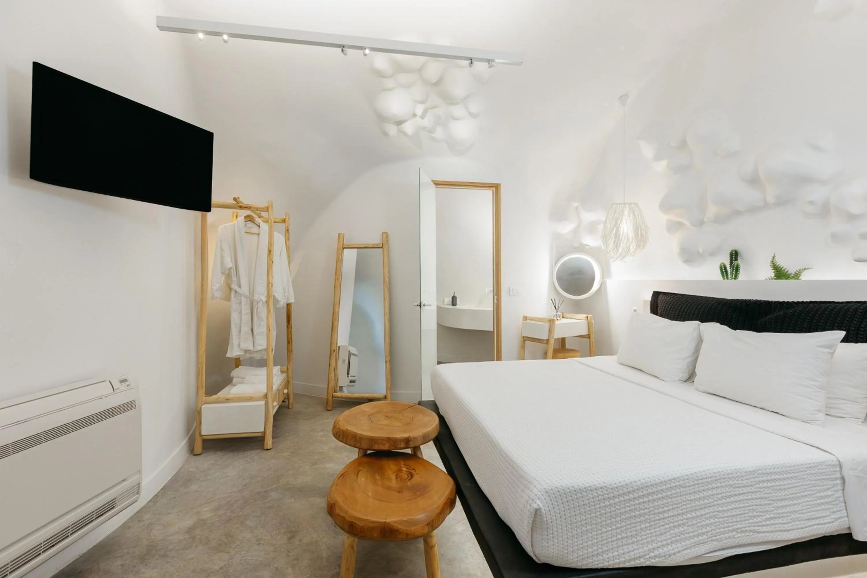 Bed in Theano Cave Suites & Villas