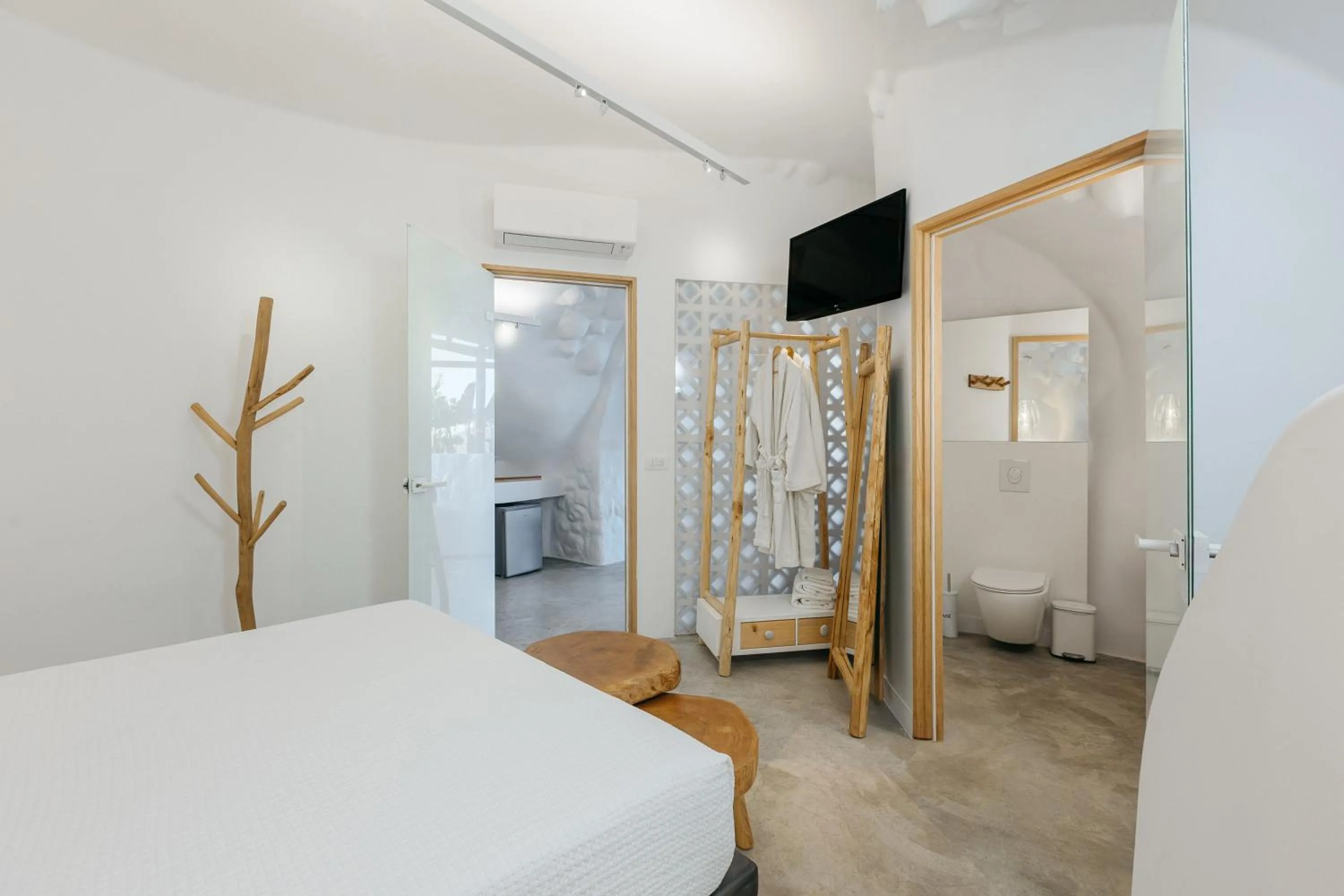 Bed in Theano Cave Suites & Villas