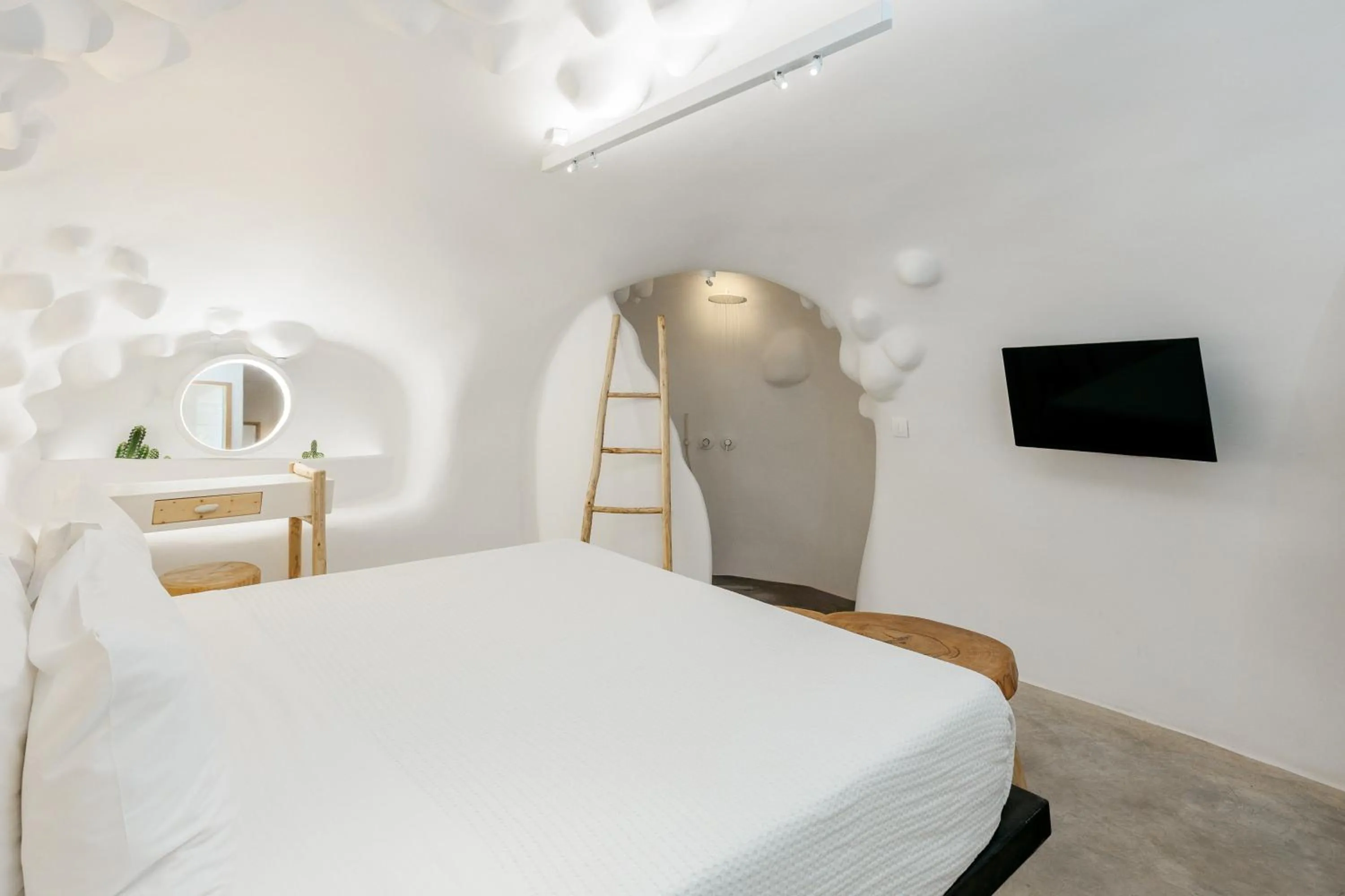 Bed in Theano Cave Suites & Villas