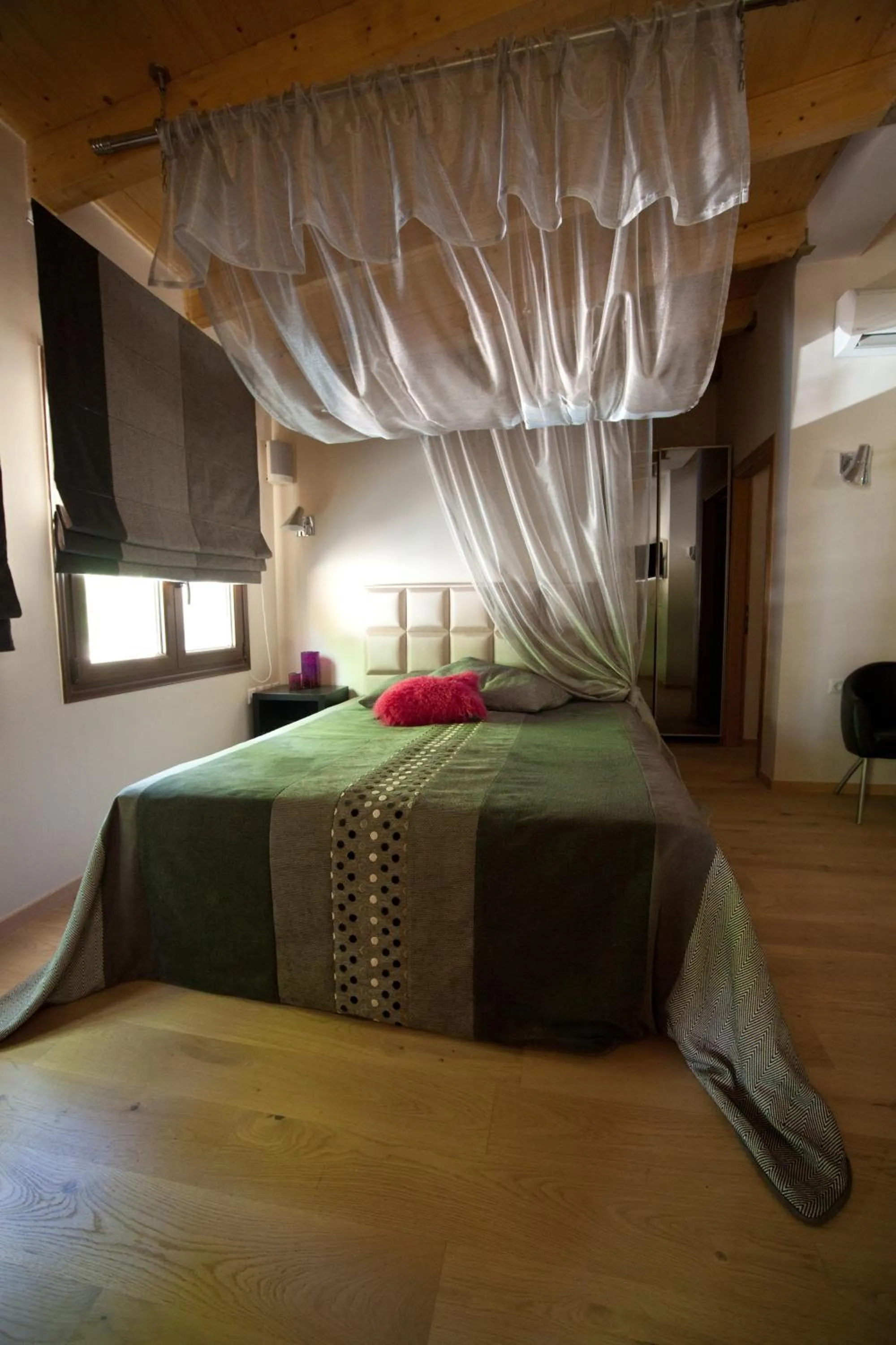 Bed in Forest Suites Boutique Hotel