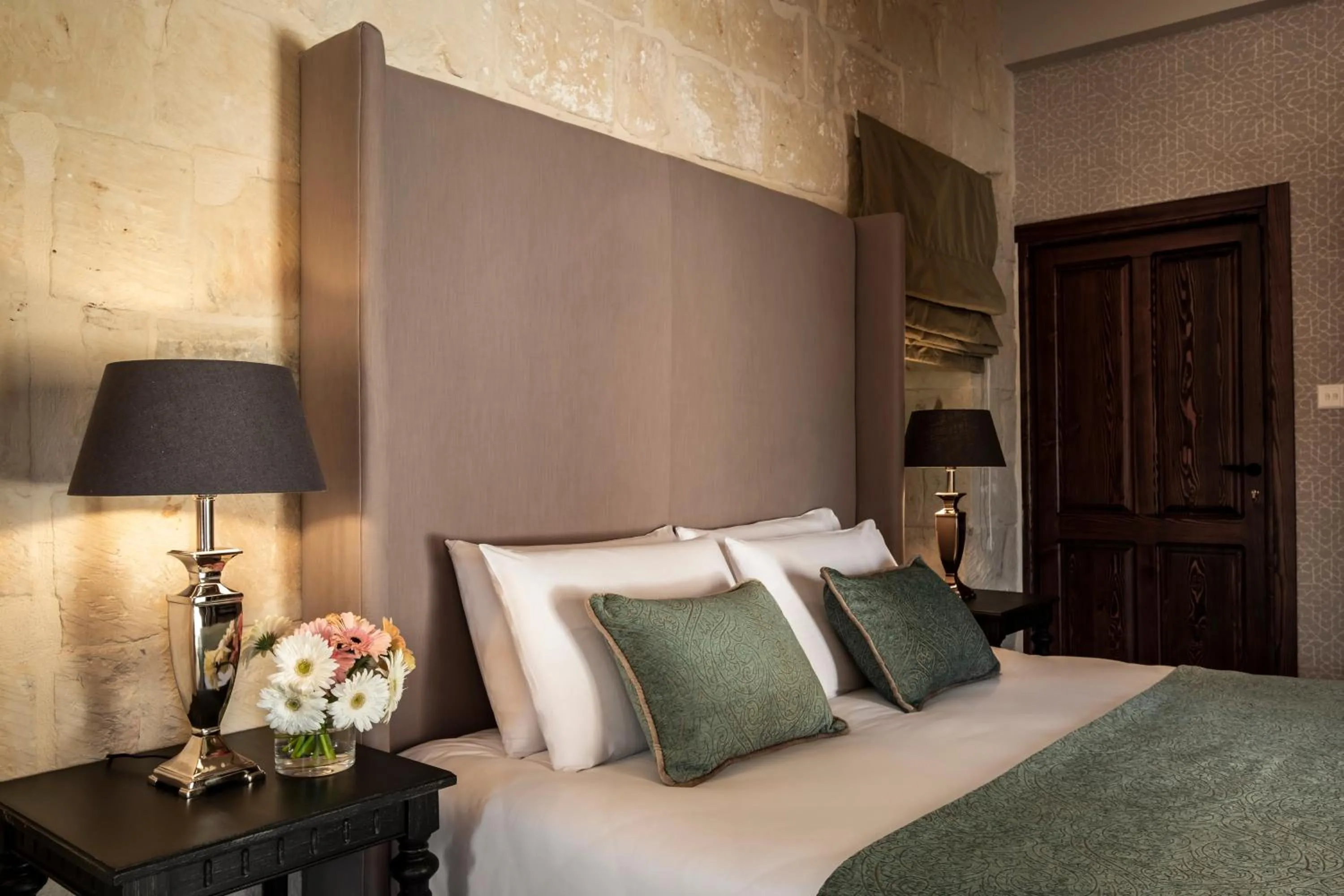 Bed in Cesca's Boutique Hotel