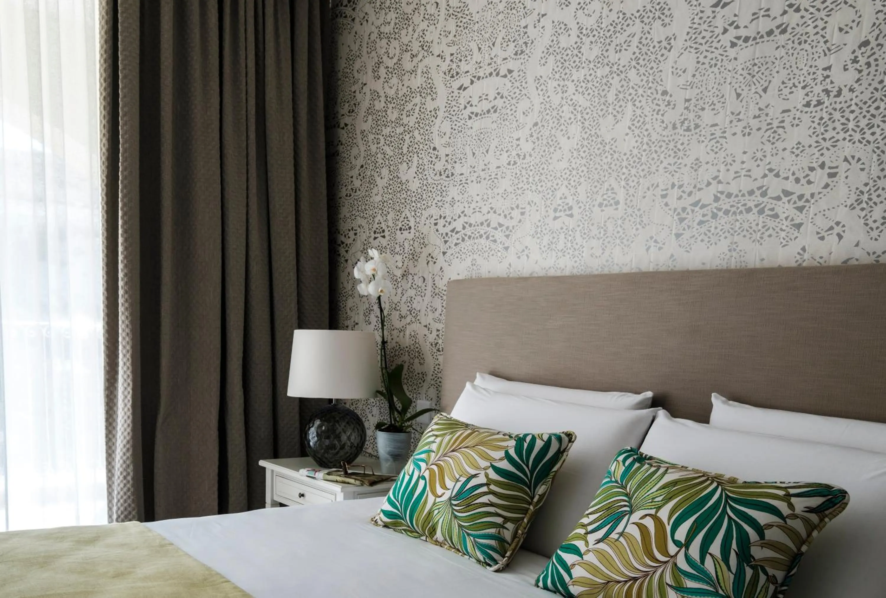 Bed in Cesca's Boutique Hotel