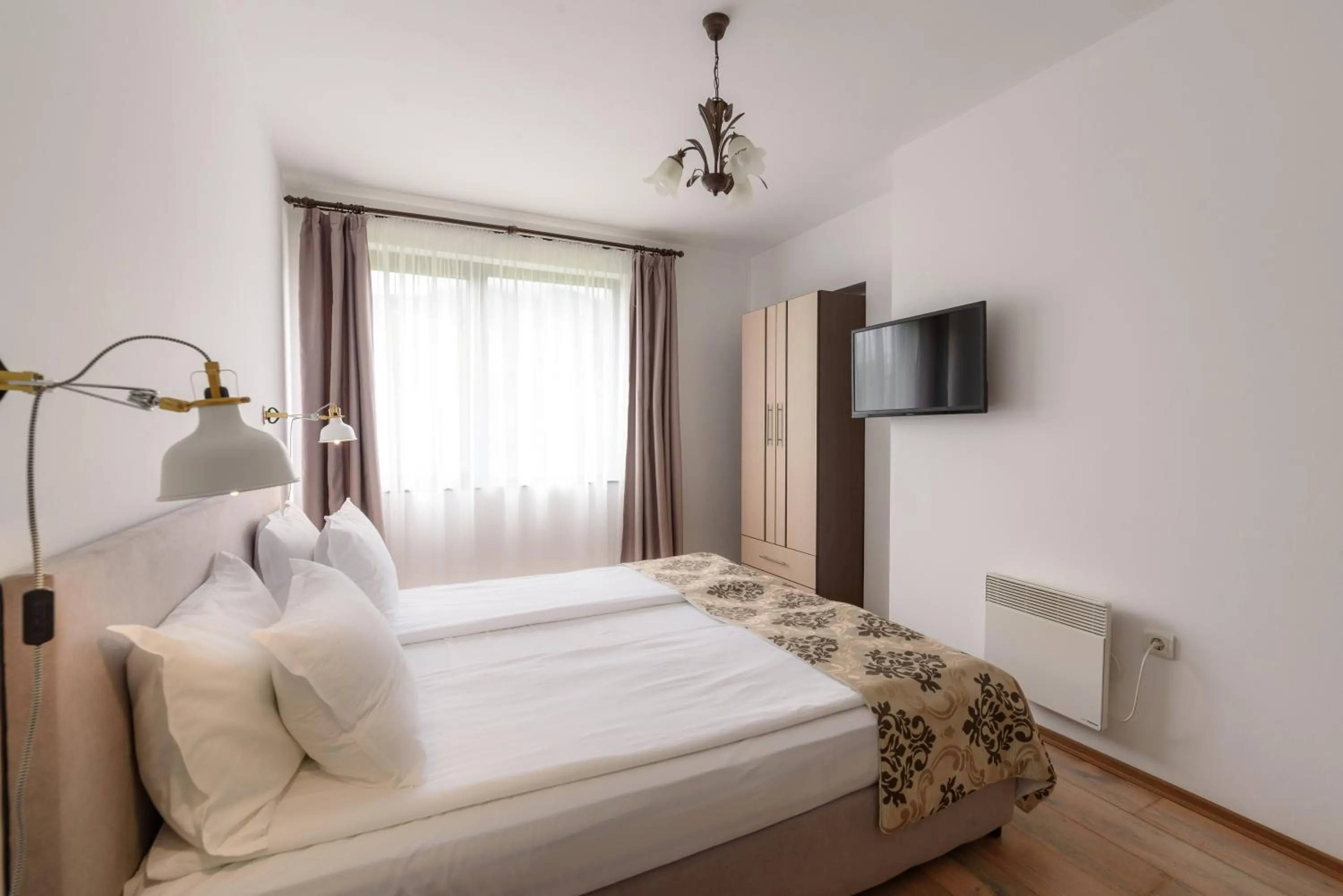 Bed in Grand Royale Apartment Complex & Spa