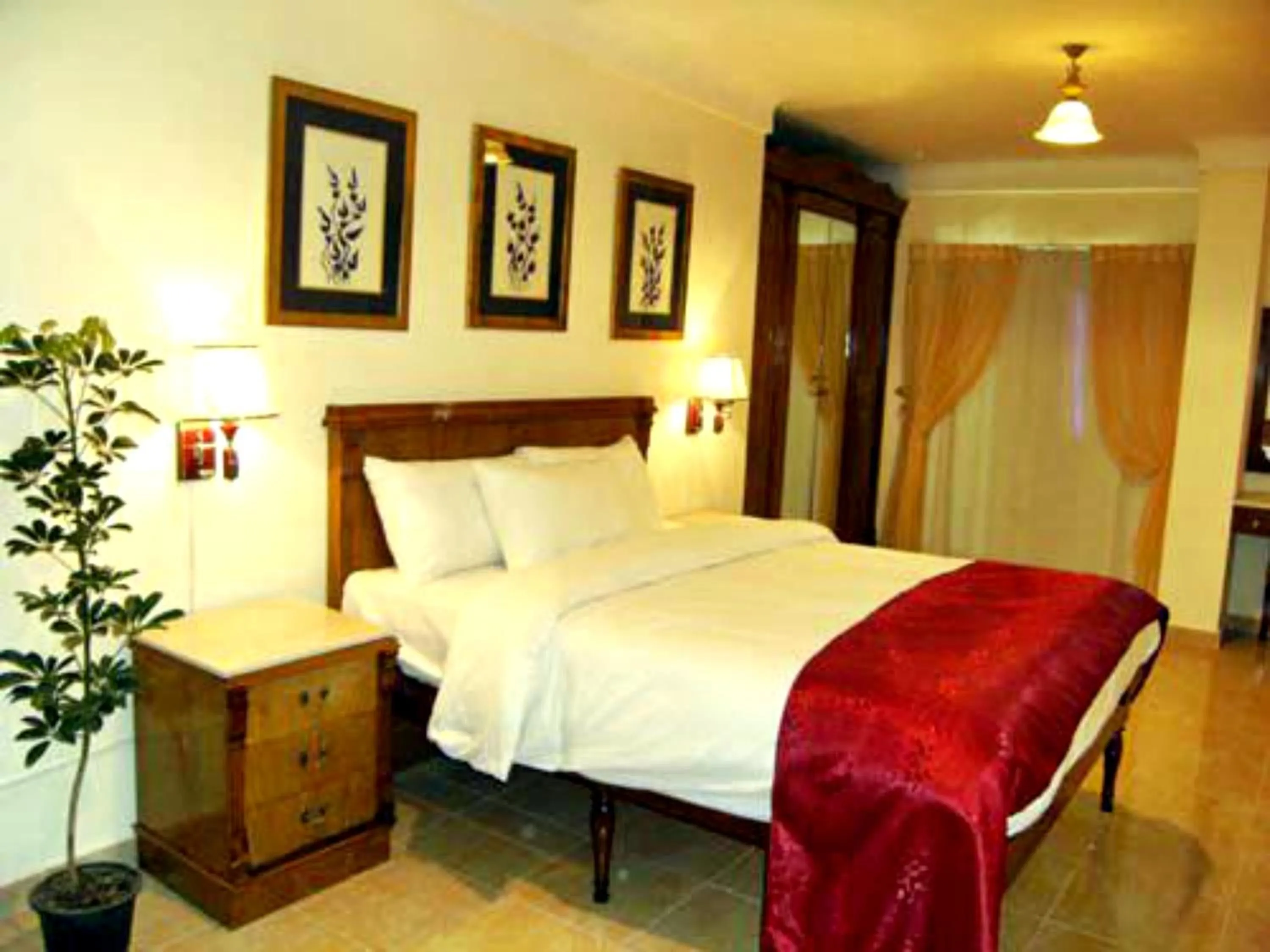 Bed in Alexandria Mediterranean Suites