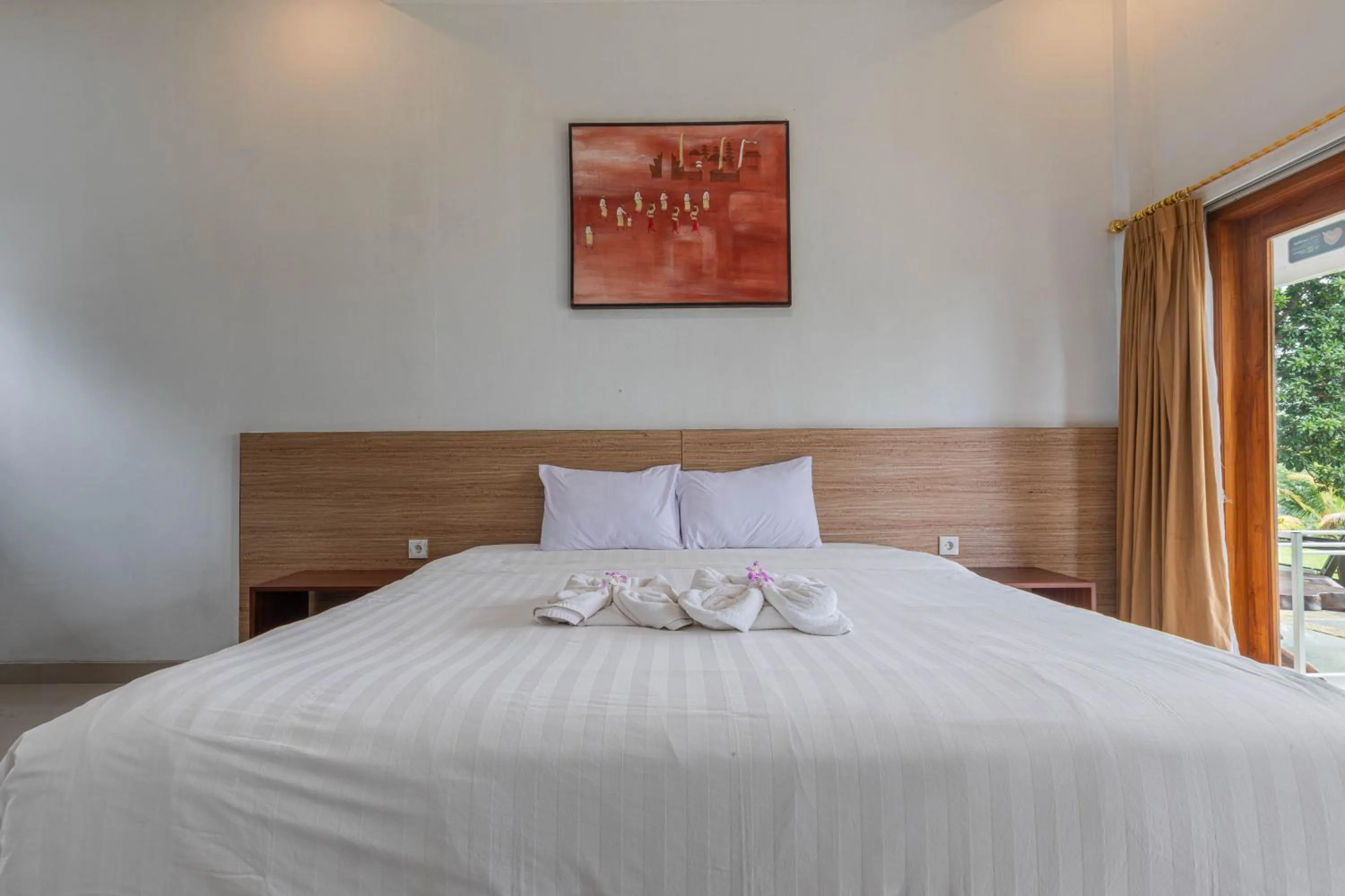 Bed in Mandhasativa Homestay