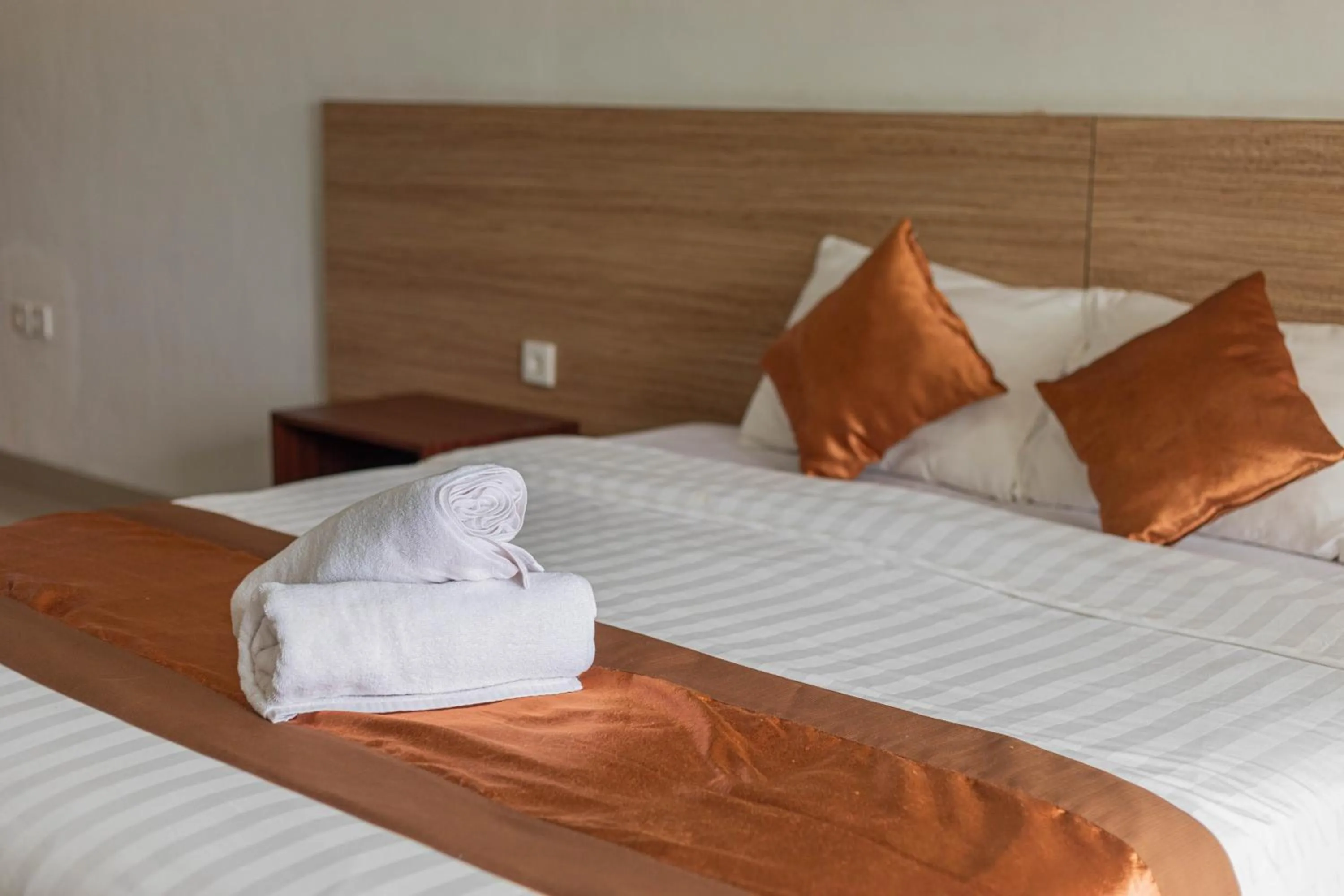 Bed in Mandhasativa Homestay