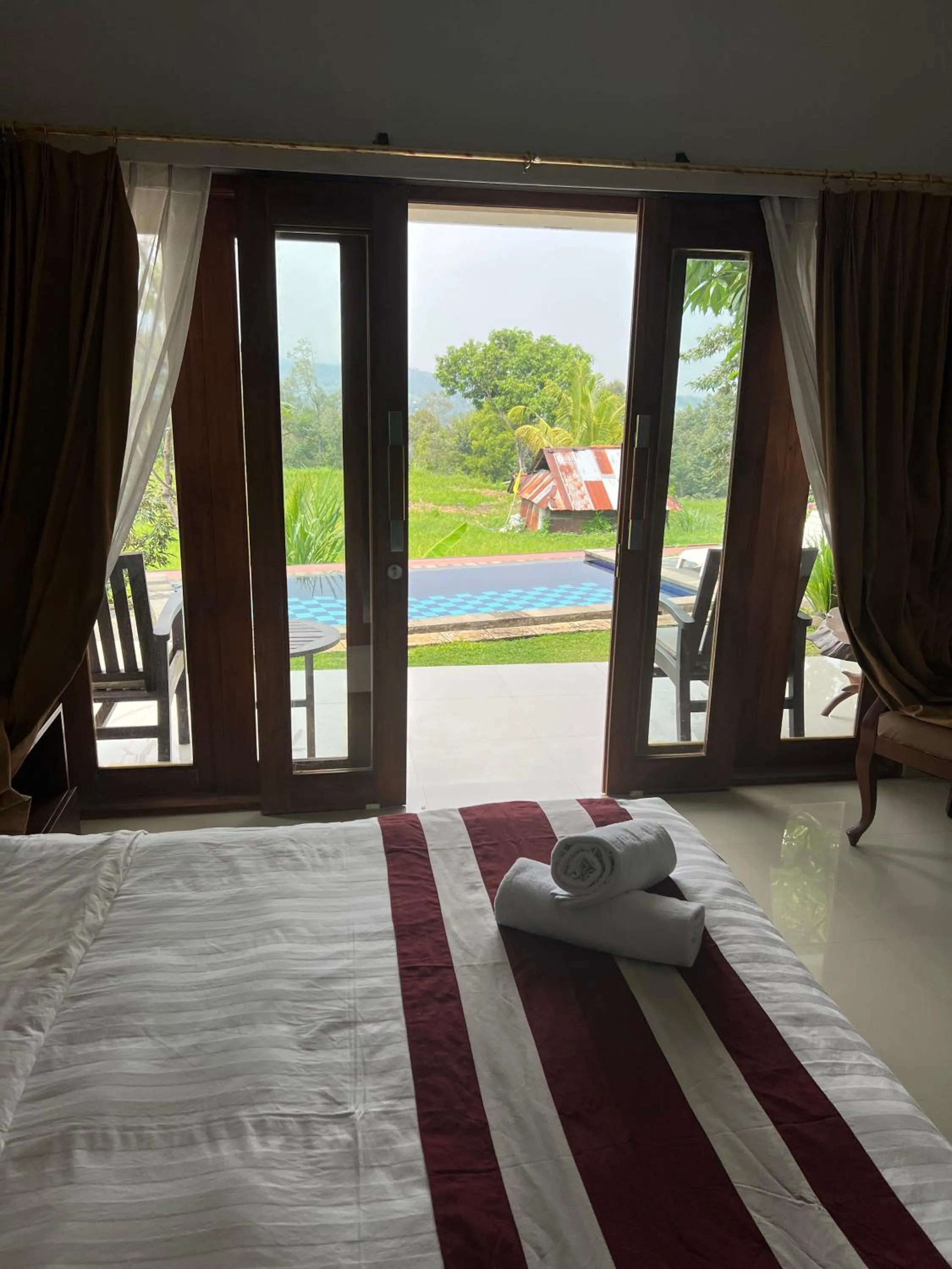 Bed in Mandhasativa Homestay