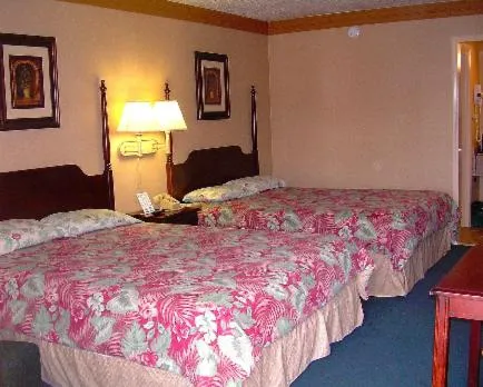 Bed in Executive Inn and Suites Springdale