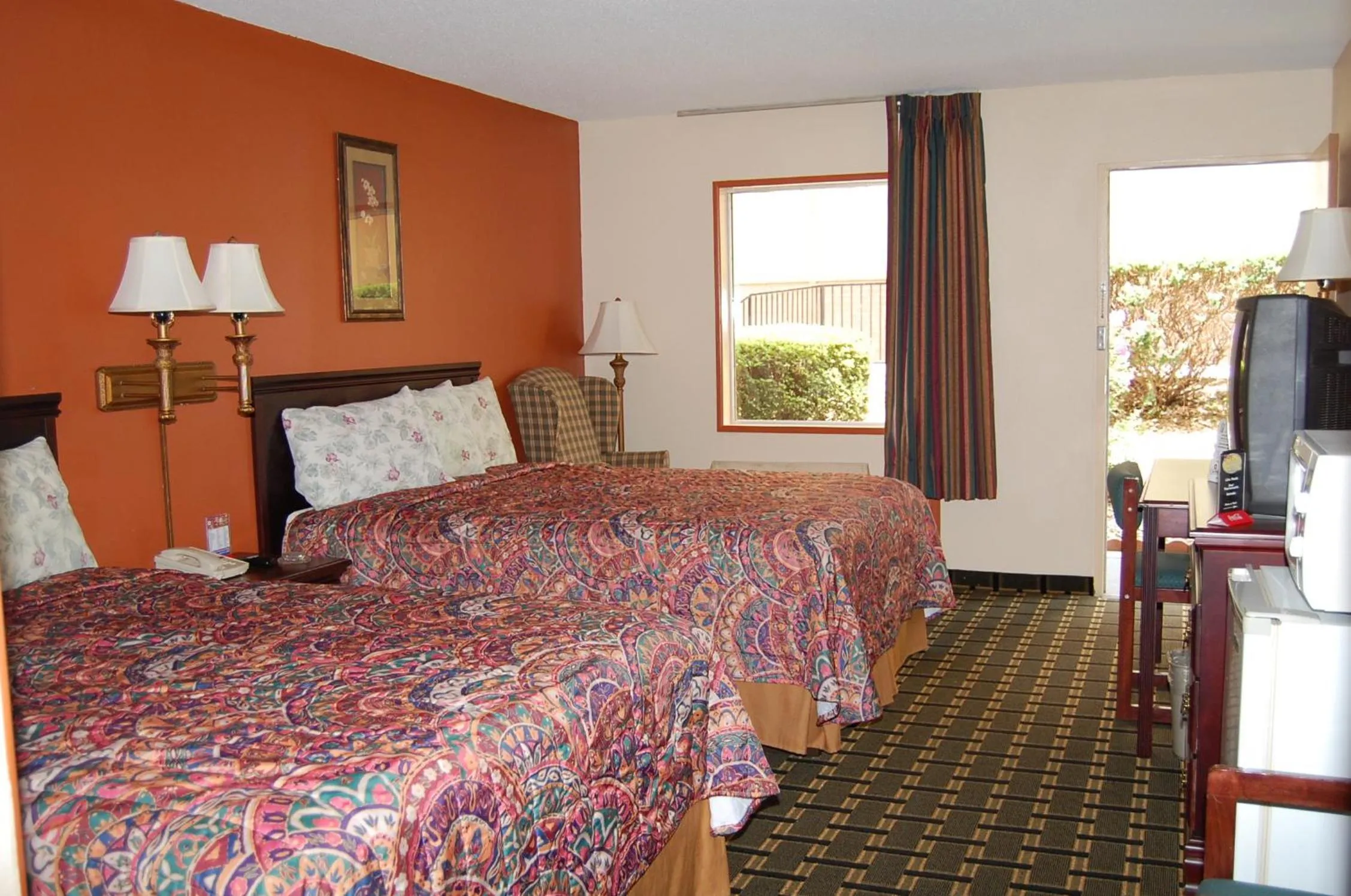Bed in Executive Inn and Suites Springdale