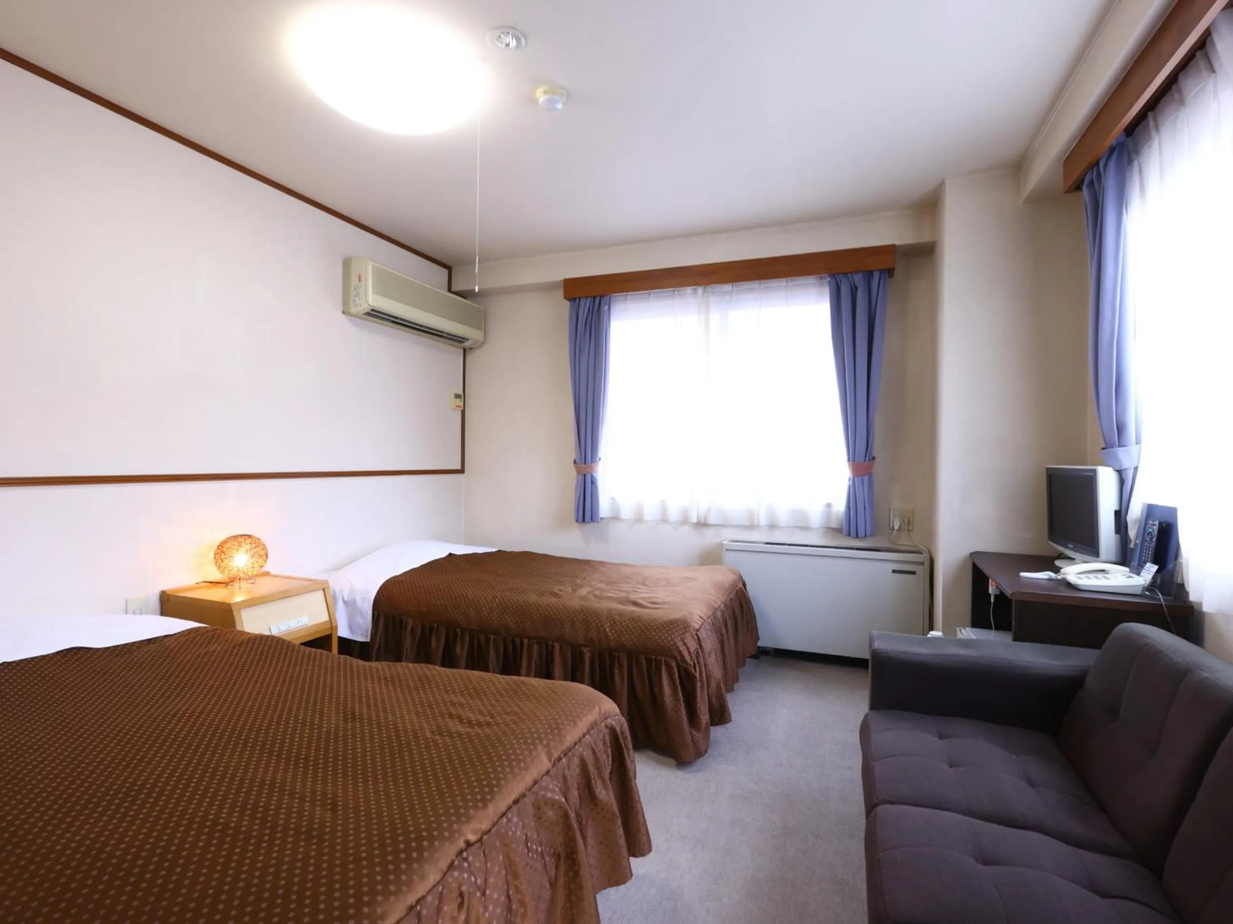 Bed in Hotel Sunplaza Tsugaike