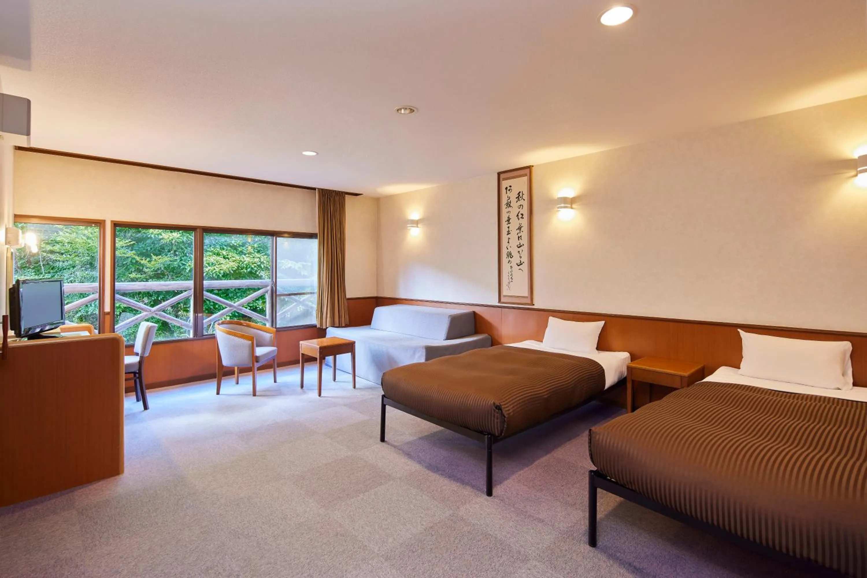 Living room, Bed in Hotel Aso No Tsukasa