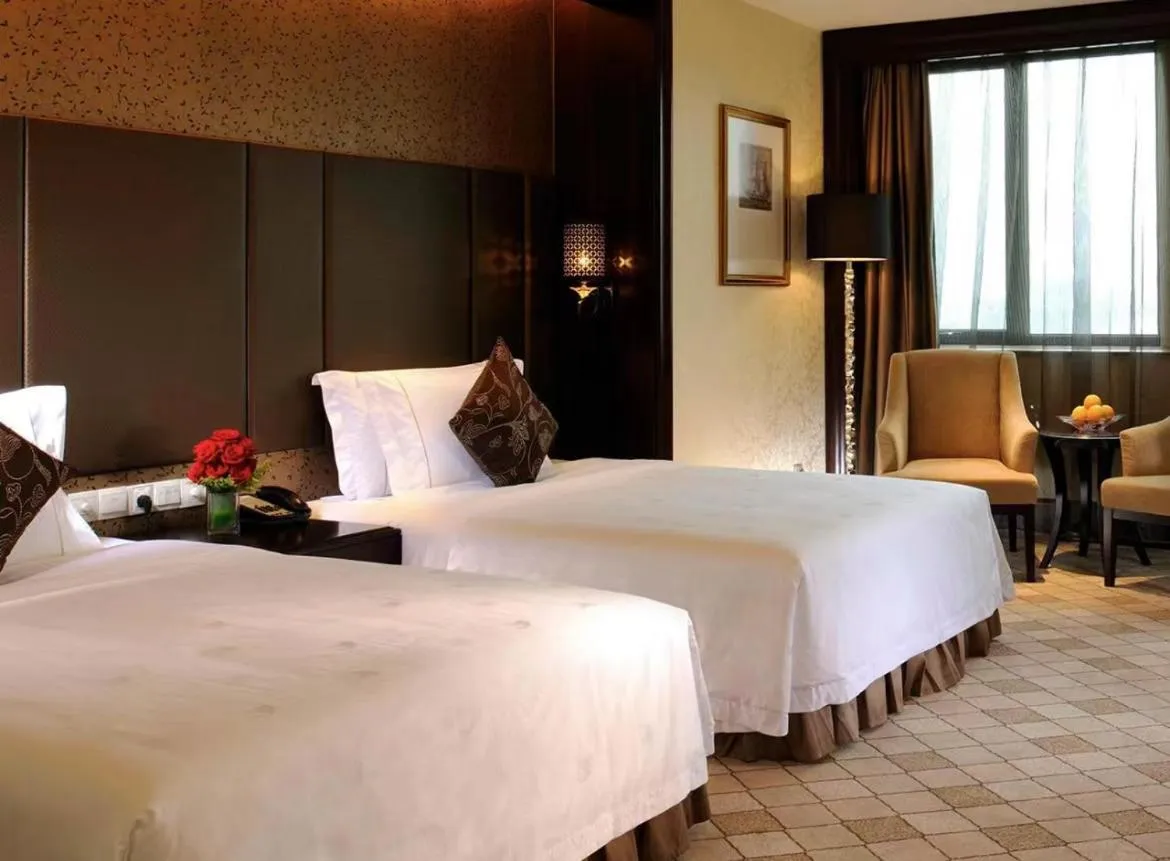 Bed in The COLI Hotel Shenzhen