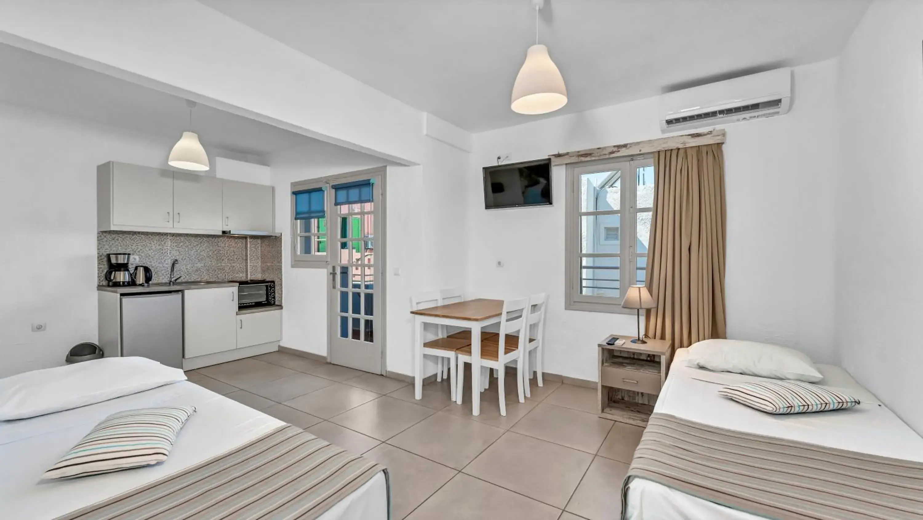 Junior Suite (Quadruple) Bedroom & Living Room in Evina Rooms & Suites Junior Suite (Quadruple) Bedroom & Living Room in Evina Rooms & Suites