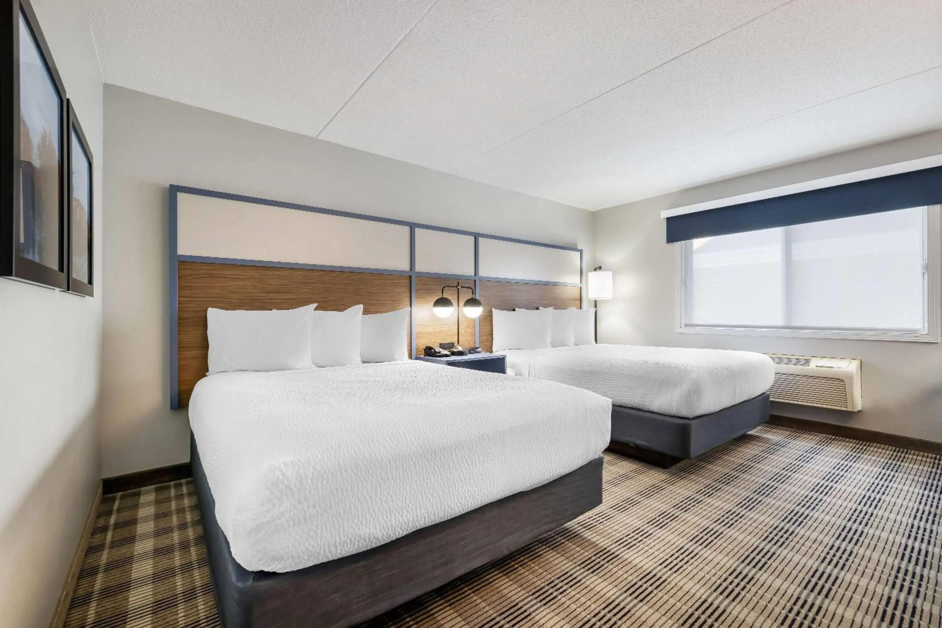 Bed in AmericInn by Wyndham Valley City Conference Center