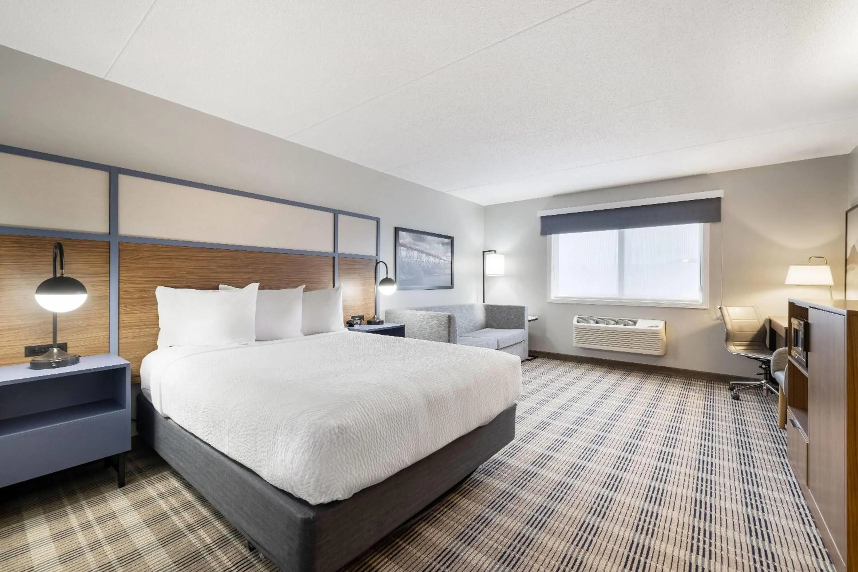 Bed in AmericInn by Wyndham Valley City Conference Center