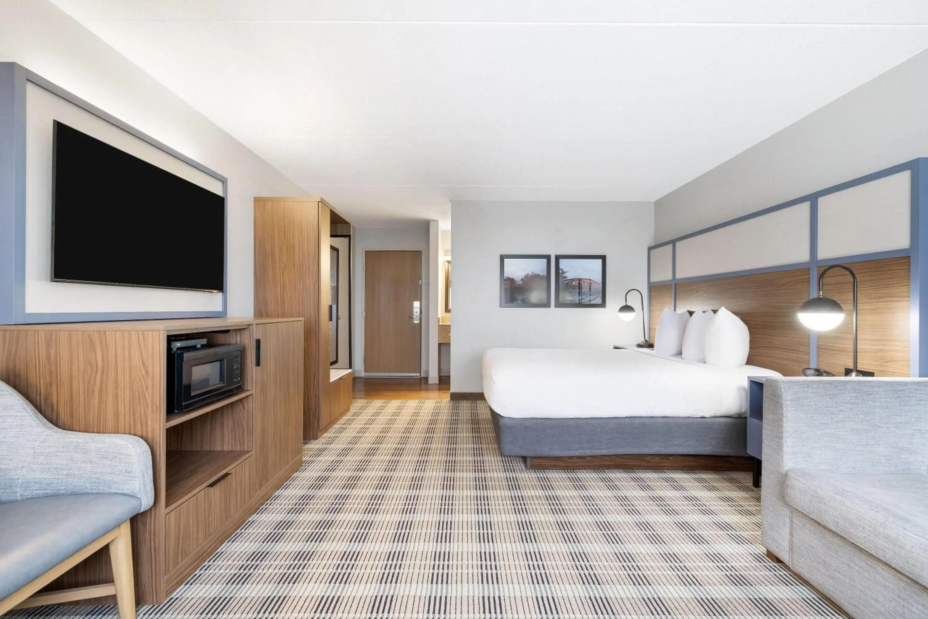 Bed in AmericInn by Wyndham Valley City Conference Center